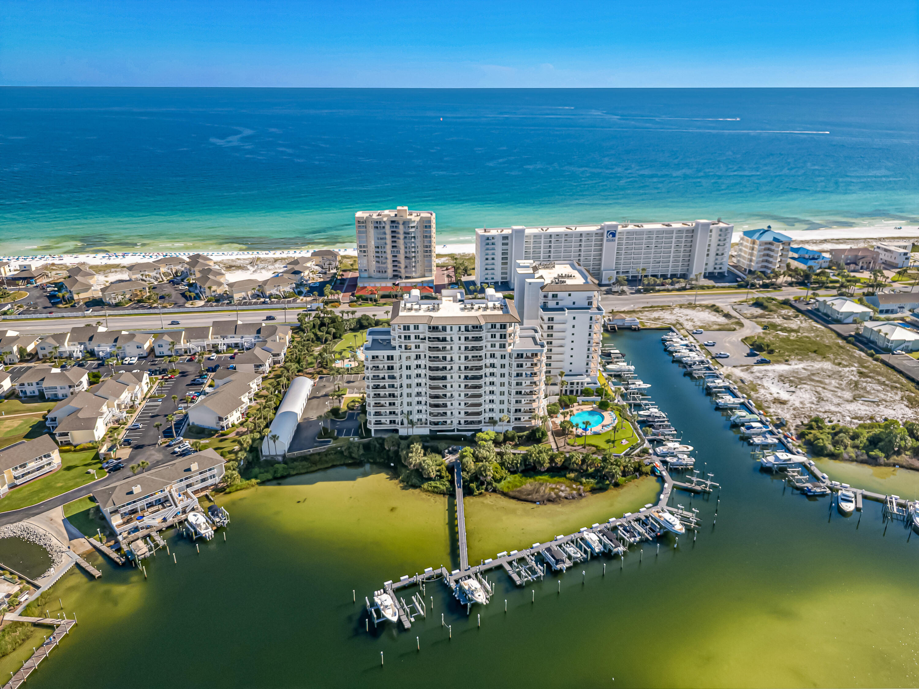 ''Exclusive low-density PENTHOUSE in the heart of Destin, perfectly situated in the upscale and semi-quiet Harbor Landing community. Enjoy luxury living with privacy, breathtaking views, and a serene atmosphere just steps from the Gulf .Soaring above the city skyline, this one-of-a-kind penthouse defines prestige and sophistication. Floor-to-ceiling glass walls frame breathtaking panoramic views from the oversized balcony while expansive living spaces blend elegance with modern comfort.Step onto your private rooftop terrace for your panoramic view, entertain in the chef's gourmet kitchen, or retreat to the spa-inspired master suite that feels like a 5-star resort. Every detail has custom finishes with 3 master bdrms with en suites. NEVER BEEN RENTED!