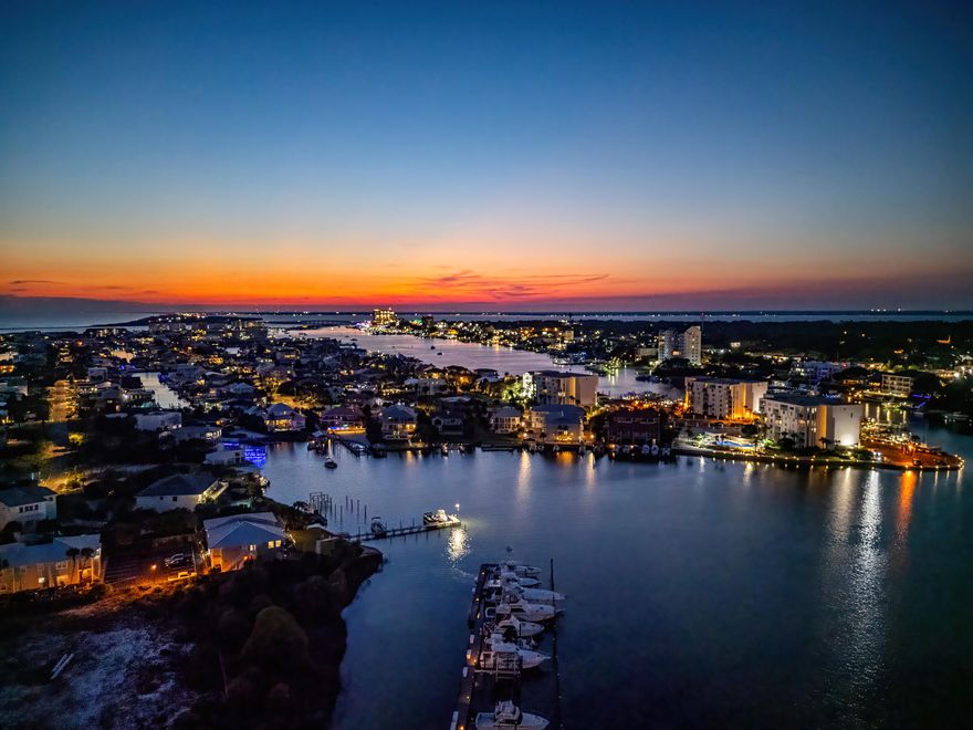 Exclusive low-density PENTHOUSE in the heart of Destin, perfectly situated in the upscale and semi-quiet HL community. Enjoy luxury living with privacy, breathtaking views, and just steps from the Gulf .This one-of-a-kind penthouse defines prestige and sophistication. Floor-to-ceiling glass walls frame breathtaking panoramic views from your oversized private balcony.You can entertain in the chef's gourmet kitchen, or retreat to the spa-inspired master suite that feels like a 5-star resort. Every detail has custom finishes with 3 master bdrms with en suites.The building offers access to a beach, marina/dock, community pool, fitness/exercise room, BBQ grills, elevators, a community room, picnic area, and ample storage. Pets are allowed. VIDEO  &  LIST OF CUSTOM UPGRADES AVAILABLE!