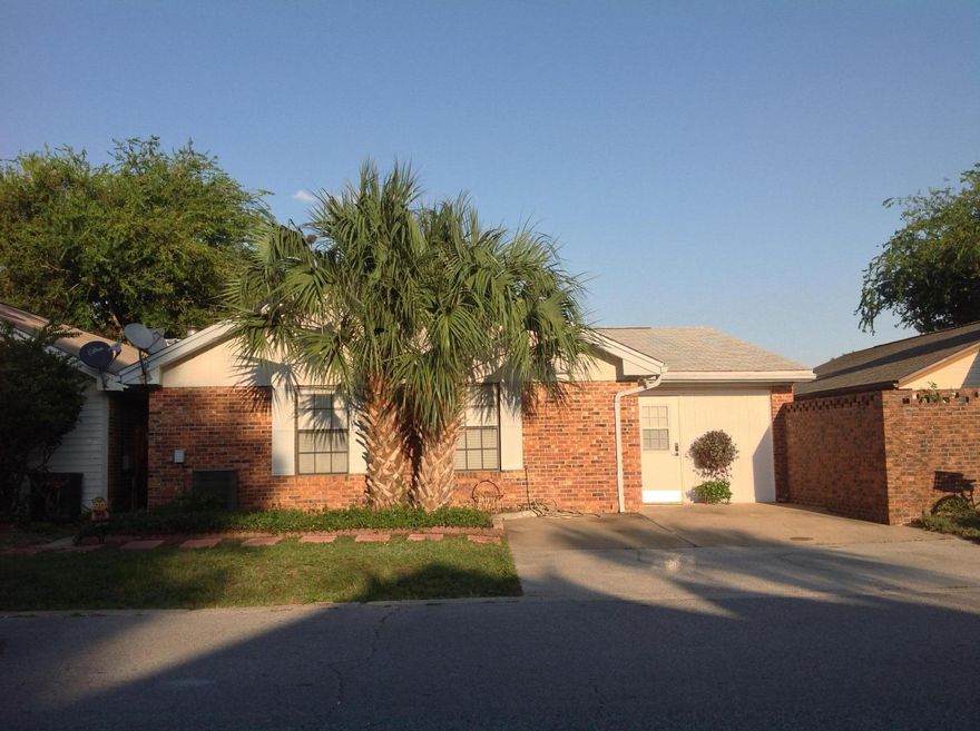 Find your own slice of paradise in the heart of Destin with this 3 bedroom, 2 bath, carefree patio home. It's vaulted ceiling and open floor plan make it live large! You will love the 3rd bedroom with its own private entrance. perfect for a roommate, mother-in-law suite or guest quarters. Both laminate and tiled floors make it a breeze to clean. Lots of closet space, plus a convenient storage closet. The fully fenced backyard has a shed, grandfathered in stay with its lucky owner. The gate in the back actually opens right up to the Dewey Destin Park, complete with tennis courts, basketball court and playground. So convenient! Its central location in the heart of Destin also makes it convenient to shopping, dining, beaches,fishing etc. Come see this gem of a home TODAY!