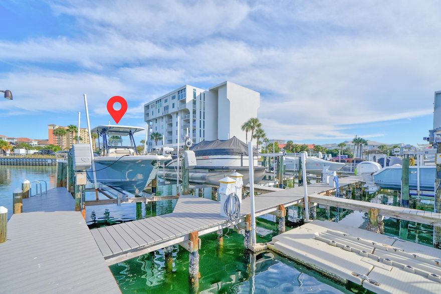 Welcome to Dolphin Point Penthouse 703A, a premier west corner residence on Holiday Isle in Destin. Offering sweeping harbor views & unparalleled resort living. INCLUDES 32' Slip #27 (10klb lift) w/ optional 2022 Key West 263 FS available!Meticulously appointed throughout with cherrywood cabinets & built-ins, granite, trey ceilings, upgraded electrical, systems & appliances - one of the largest  floor plans in the complex with 3 bedrooms & 2 bathrooms at 2280 sq ft. Third bedroom currently used as home office. Enjoy morning coffee & evening sunsets off the master balcony; overlooking the tennis courts & marina.Unit also includes large exterior storage room located on the 7th floor. Schedule your private your today and experience for yourself highly coveted Holiday Isle living! Dolphin Point is a luxury gated community situated on Holiday Isle in Destin.  The complex features a large, seasonally heated swimming pool (located behind Building C), a waterfront clubhouse (w/full kitchen - located behind Building A), grilling area, tennis & pickleball courts, marina (Slip 27 deeded to Unit 703A), paddle board & kayak storage, deeded community beach access, golf cart parking available, elevators, water taxi available and 24 hour security.