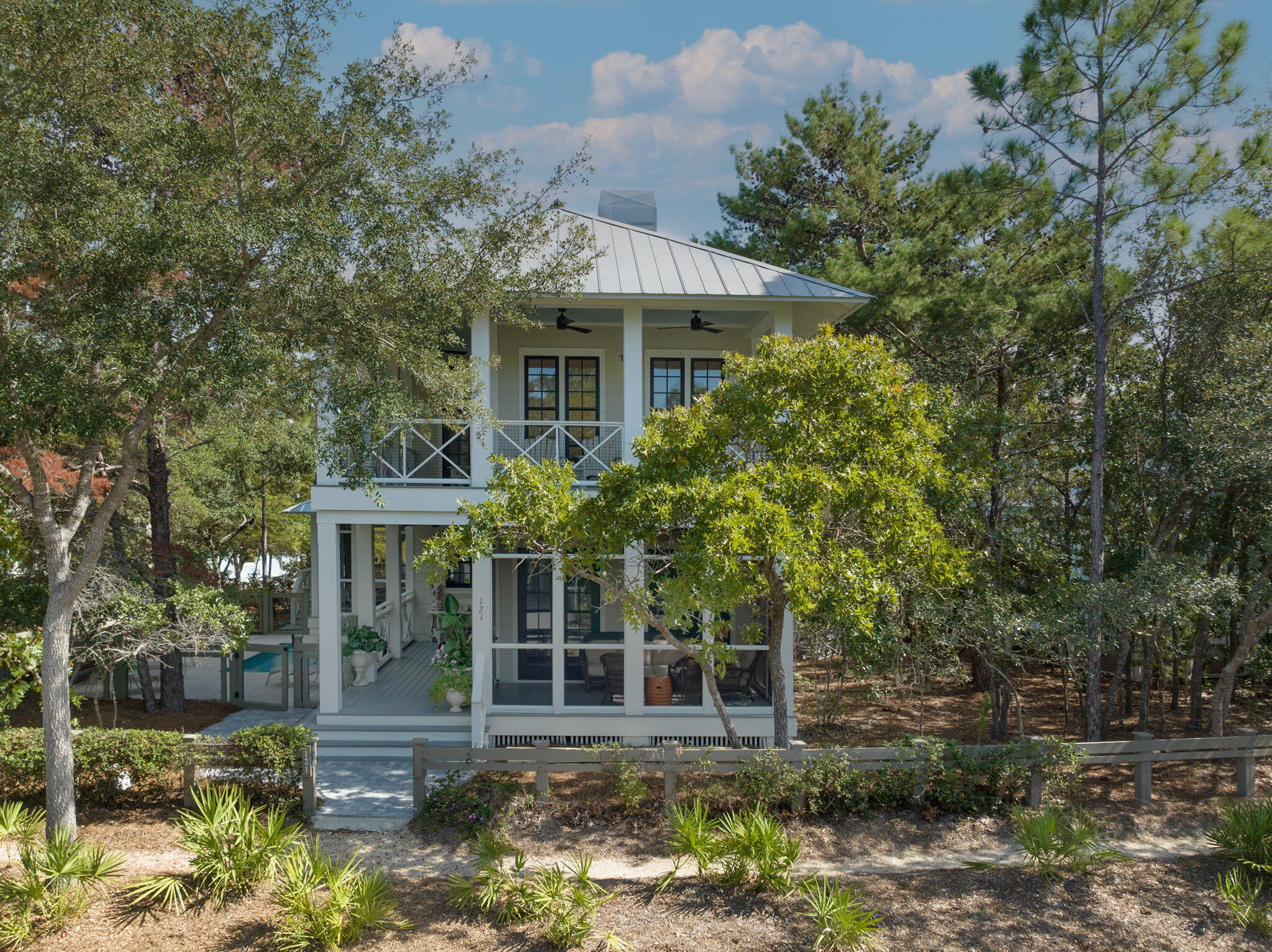 This newly renovated house is a coastal retreat that embodies Florida resort living at its best. In close proximity to Camp WaterColor's excellent amenities. Relax in the heated, saltwater pool with carefree landscaping.  Two screened porches. The large 1st floor screened porch has a seating area & large table to take advantage of alfresco dining. The first-floor open plan connects the living area with a sitting area, dining area & kitchen on the first floor.  The kitchen has Wolf, Sub Zero & Bosch appliances, along with a separate ice machine.  Countertops & backsplash are marble.  Master bedroom & bathroom are conveniently located on the first floor.  Remaining bedrooms & bunk area are located on the second floor. There are storm shutters for the windows. Room dimensions are approx.