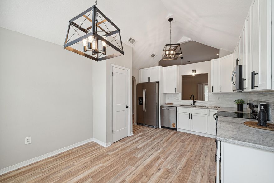 Priced to sell!!  Step into this 100% renovated home, designed with modern upgrades and stylish finishes! This home features a brand-new kitchen, complete with new cabinets, granite countertops, updated lighting, a sleek sink, fixtures, and stainless steel appliances, Interior Highlights, Luxury laminate flooring throughout the living areas & soft carpeting in the bedroomsBoth bathrooms updated with new cabinets, lighting, mirrors, and fixtures,Freshly painted exterior brick, Covered patio for relaxing outdoor gatherings,Finished garage flooring for a polished look