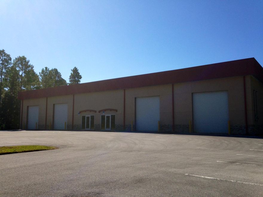 13,000 SF total (130'x 100'), with Four (4) roll-up doors in front each 12' x 20' and Two (2) roll-up doors in back each 12' x 20'. Clear Span is 20' with eave height at 25'. Stubbed out for Two (2) bathrooms and has two electrical panels in place. Built in 2008. Property was designed to be subdivided into two equal spaces with their own glass entry areas and each one having two roll-up doors in front and one in back. In addition the building has lots of natural light via 32 sun lights and has 12 sodium lights. This would be a great place to have your business and rent out the other side to lower your occupancy cost.