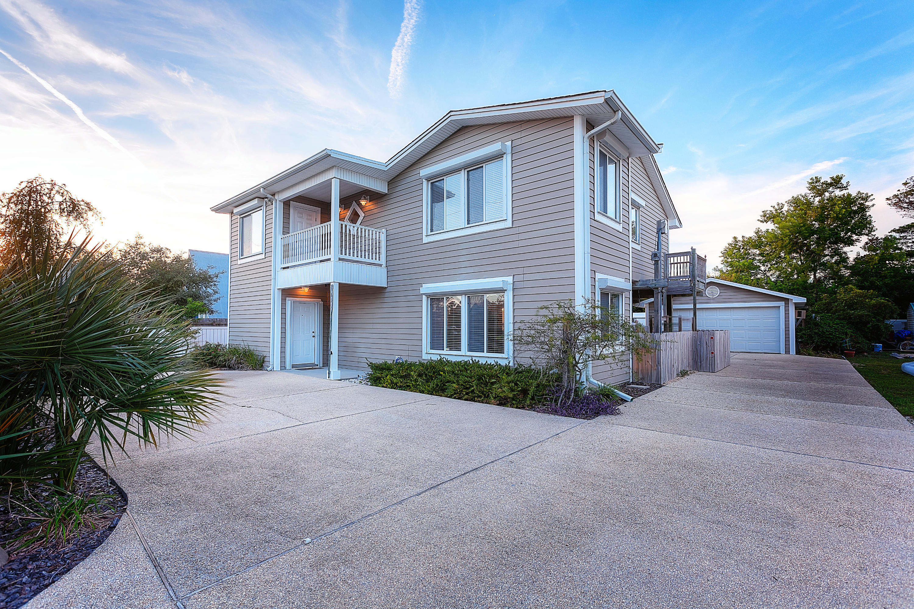 Check out the view! Just a couple of blocks from the white sands of the Gulf of Mexico. Because of its close proximity to the beach, this home is perfect for full time residence, long term rental, or that perfect vacation spot. Freshly painted. Beautiful built in gas fireplace. Plenty of storage. 2 car garage with a workbench and lots of shelves and cabinets for storage. The kitchen was renovated and has custom cabinets, granite tile countertops and backsplash, soft close drawers, and more. The master suite is huge with French doors that lead outside to a porch with a bar and TV. Enjoy the views of the Gulf of Mexico and the beautiful sunsets from the roof-top tower. No flood insurance and no association dues keep the cost to own low.