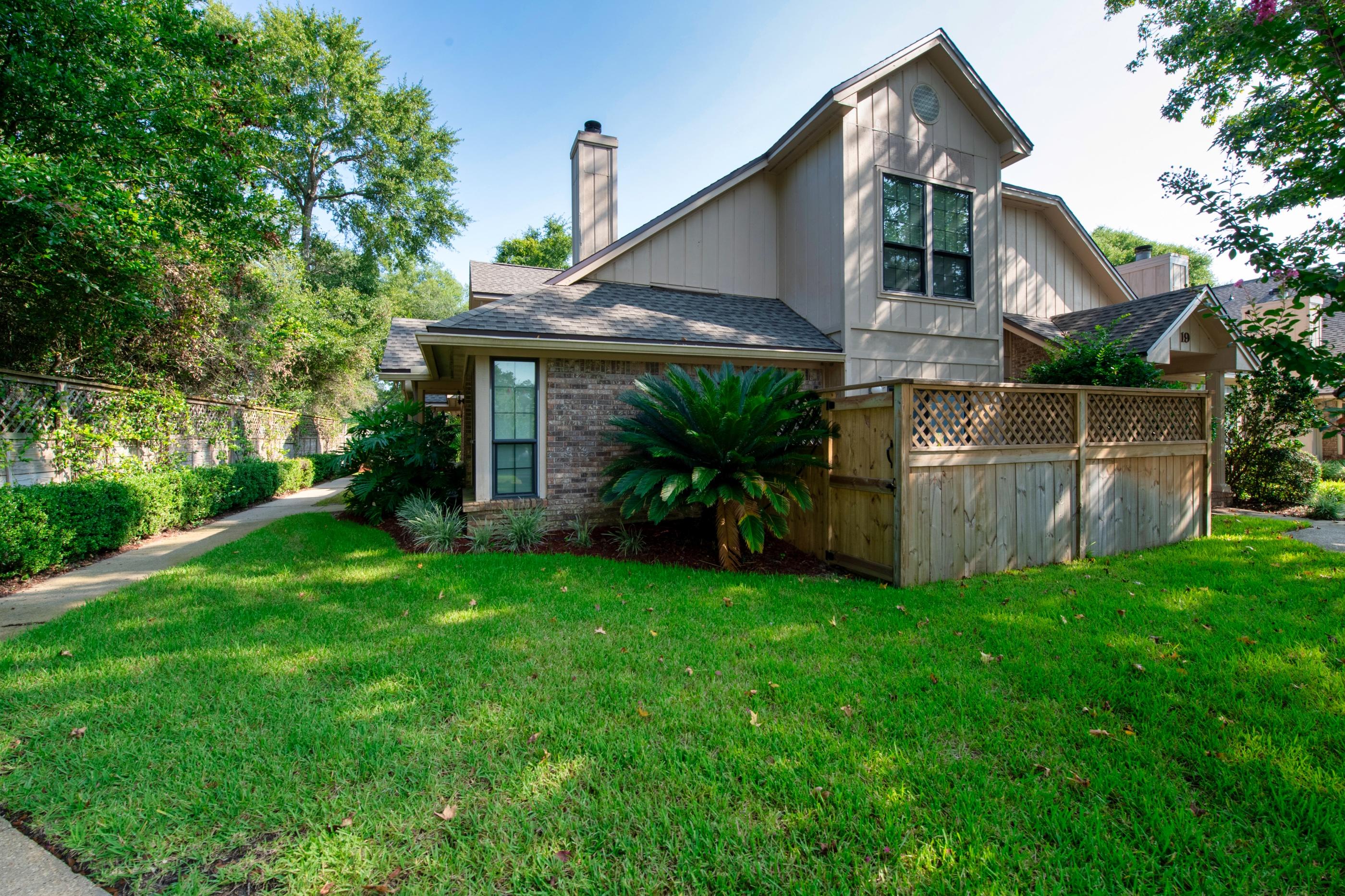 Check out this hidden gem! This townhome is minutes from Eglin &Hurlburt. Open the door to the main living area with cathedral ceilings and a wood-burning fireplace. The kitchen has been updated with white cabinets, back splash and upgraded fixtures. The first bedroom rests on the first floor with a walk-in closet, ceiling fan and en-suite with tub/shower combo. The second-floor loft looks out onto the main living area and makes for a great office or play area. The bedroom on the second floor has two large windows bringing in an abundance of natural light. The room features a large walk-in closet, vaulted ceilings and the additional bathroom with upgraded fixtures and a double vanity. Spend your days relaxing on the fenced in patio or inside next to a fire. Make this property yours TODAY!