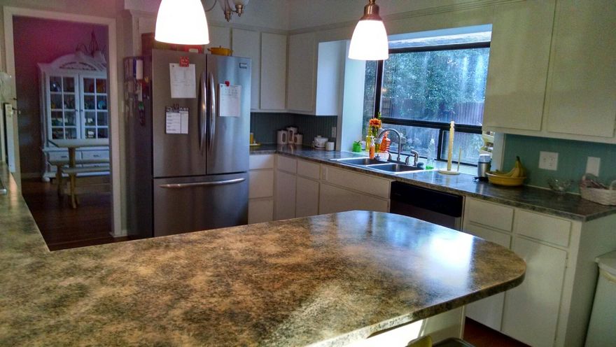 Best buy on the market! Brick home on large corner lot beaches and both bases. Spacious open kitchen with stainless appliances and breakfast bar to family room. Formal living room and light and bright dining room overlooking the private back yard. Master and two additional bedrooms on the main floor with two baths. Two large bedrooms and one bath on the second floor. Florida room with floor to ceiling glass overlooking private back yard space. Hardwood floors grace the stairs and continue throughout the upstairs. Fully fenced back yard provide a private area for entertaining and a great space for kids to play. Lots of mature shrubs and a fountain complete the space. Copper wiring! Two car garage with a large circular brick paver driveway for extra parking. Room to park a boat or RV.