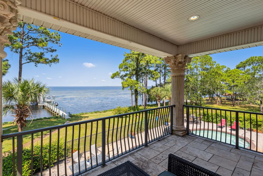 Appraised higher than asking price! Located on a cul-de-sac and on the water! With unobstructed views of the bay from most of the rooms. This custom built 5 bedrooms and 6 bathrooms plus 2 bonus rooms home, offers a spacious floor plan. Winding staircase in the entrance. Master suite with big closets located downstairs; library, fireplace, gourmet kitchen, 3 car garage. Big backyard with a swimming pool and large deck. The seller added a boat dock and a generator. This home is built up to a 10' elevation providing additional protection and resilience. Overall, this home presents a comprehensive living experience, blending indoor comforts and outdoor amenities to create a truly desirable property.