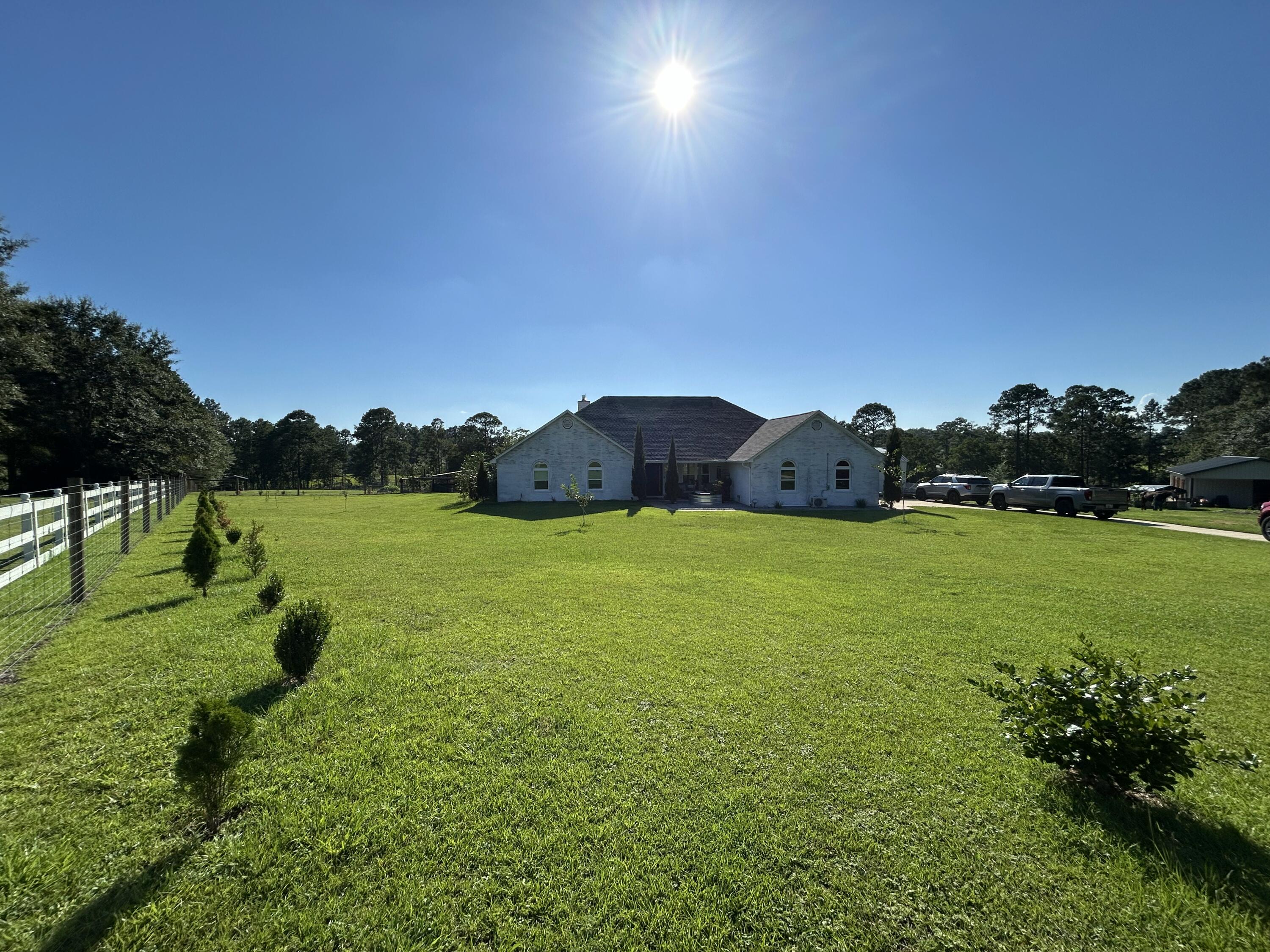 Beautifully maintained 4BR/3BA home with 2,495 sq ft on a fully fenced estate. Features include 3 pastures, 3-stall barn with tack room, run-in shelter, chicken coop, garden, fruit trees, and stocked pond. Interior upgrades: remodeled kitchen/baths, custom closets, new windows, roof, HVAC, and more. Saltwater pool, insulated garage, custom shed, and serene outdoor spaces. Stock tanks and portable pens do not convey. Ideal for horse lovers or hobby farmers. Schedule your showing today!