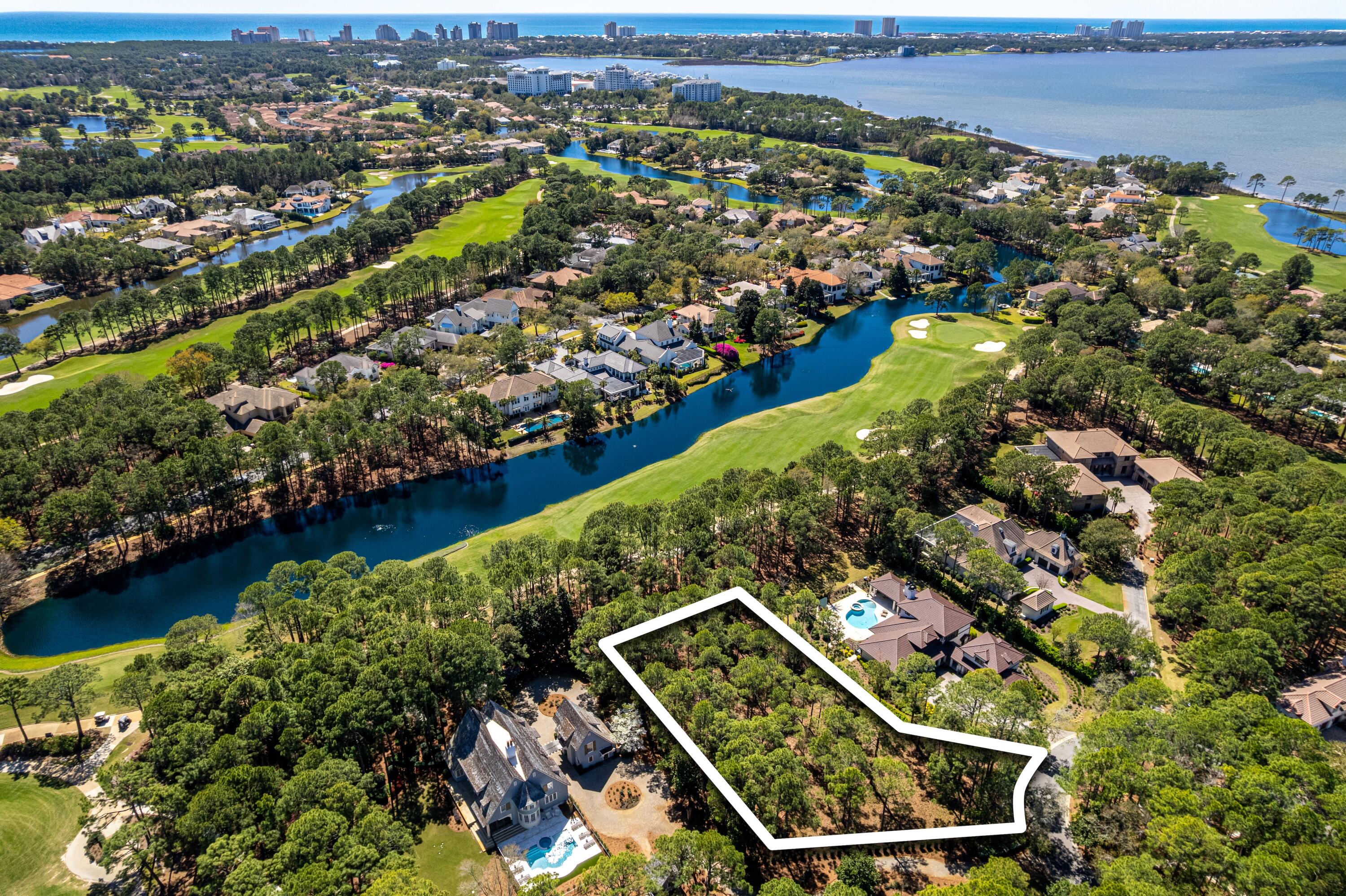 Discover an unparalleled opportunity to build your dream home in Merion, one of the most coveted enclaves within the private gates of Burnt Pine at Sandestin Golf and Beach Resort. Nestled at the end of a cul-de-sac, this expansive 3/4-acre homesite boasts breathtaking views of the lake and 10th fairway on the renowned Burnt Pine Golf Course. Whether you envision an elegant 4,000-square-foot retreat or a sprawling 8,000-square-foot estate, this prime location offers endless possibilities for luxurious living tailored to your vision. With privacy, security, and stunning golf course scenery, this is a rare chance to create a home that perfectly blends sophistication with the relaxed lifestyle of Sandestin. Your dream build starts here! Sandestin Golf and Beach Resort features more than seven miles of beaches and pristine bay front, four championship golf courses, 15 world-class tennis courts, a 226-slip marina, a fitness center, spa and celebrity chef dining. Shop, dine and play at the charming pedestrian village, The Village of Baytowne Wharf and more. Inside the gates of the resort, residents enjoy a balanced lifestyle of high-class living, spanning the 2,400 acres from the beach to the bay. Everything within the gates of the resort is accessible by golf cart or bicycle. The entire resort is interconnected by miles of pedestrian, bike and golf cart paths that weave through groves of live oaks, meandering past natural lagoons, fountains, man-made lakes, and meticulously landscaped fairways.