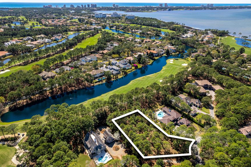 Discover an unparalleled opportunity to build your dream home in Merion, one of the most coveted enclaves within the private gates of Burnt Pine at Sandestin Golf and Beach Resort. Nestled at the end of a cul-de-sac, this expansive 3/4-acre homesite boasts breathtaking views of the lake and 10th fairway on the renowned Burnt Pine Golf Course. Whether you envision an elegant 4,000-square-foot retreat or a sprawling 8,000-square-foot estate, this prime location offers endless possibilities for luxurious living tailored to your vision. With privacy, security, and stunning golf course scenery, this is a rare chance to create a home that perfectly blends sophistication with the relaxed lifestyle of Sandestin. Your dream build starts here! Sandestin Golf and Beach Resort features more than seven miles of beaches and pristine bay front, four championship golf courses, 15 world-class tennis courts, a 226-slip marina, a fitness center, spa and celebrity chef dining. Shop, dine and play at the charming pedestrian village, The Village of Baytowne Wharf and more. Inside the gates of the resort, residents enjoy a balanced lifestyle of high-class living, spanning the 2,400 acres from the beach to the bay. Everything within the gates of the resort is accessible by golf cart or bicycle. The entire resort is interconnected by miles of pedestrian, bike and golf cart paths that weave through groves of live oaks, meandering past natural lagoons, fountains, man-made lakes, and meticulously landscaped fairways.
