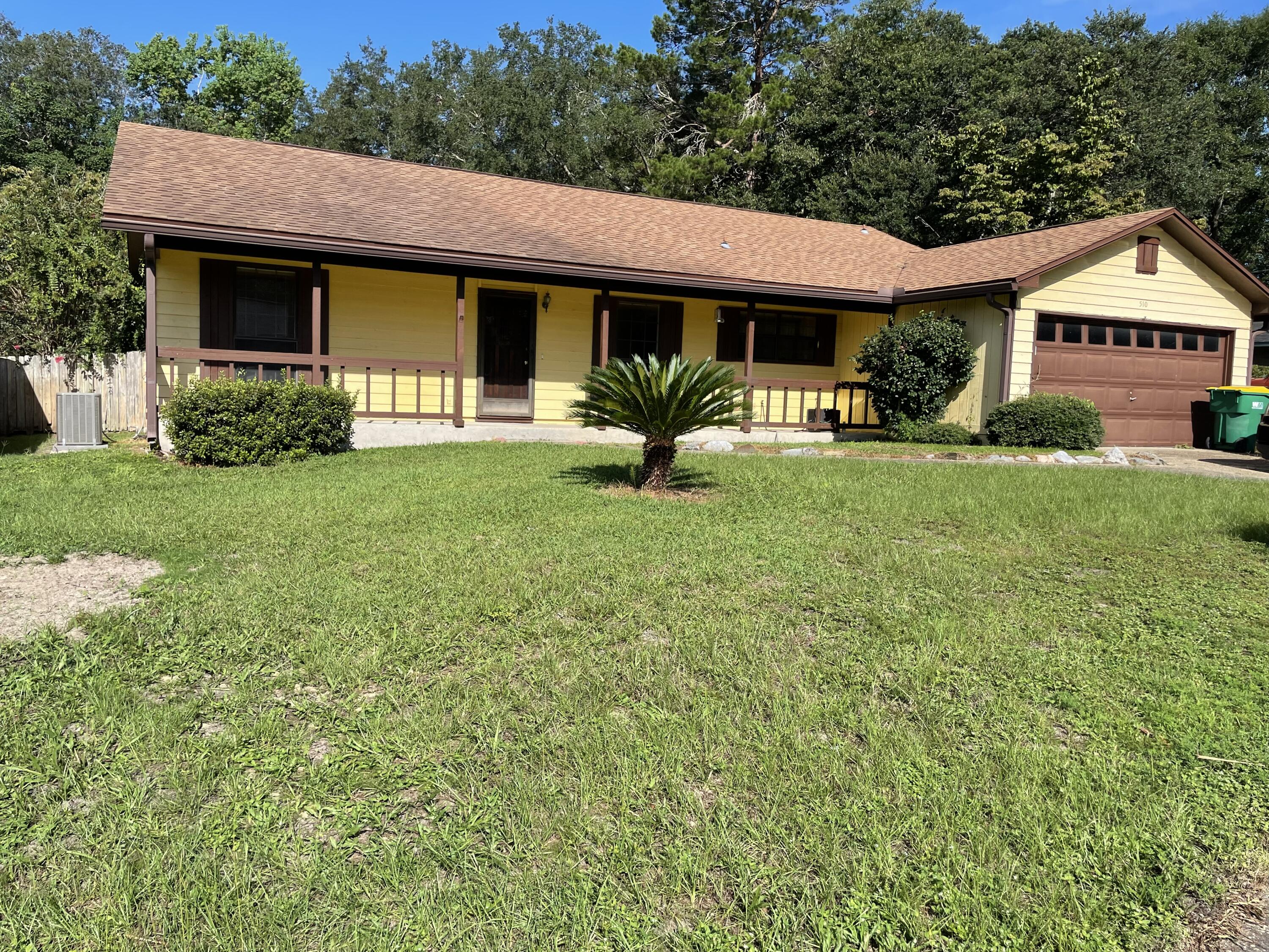 Great Location!!! Centrally located in Niceville just minutes from the Eglin AFB, beaches, and Destin-FWB Airport. This 3/2 home sets on a large lot, in a great neighborhood. The home offers a split floor plan with the guest bedrooms and master bedroom being on opposite sides of the home. The covered front porch is great for a porch swing or a couple of rocking chairs. The kitchen and dining area are side by side with easy flow of traffic when entertaining from family room and entry way. The kitchen has tile counter tops, oak cabinets, pantry and laundry room off the kitchen. The large backyard has lots of mature landscaping, which you can enjoy from the oversized screened porch. New Gutters - 2020, New HVAC - 2014, Water Heater - 2011 and Roof - 2008. New LVP flooring in living room 2022.
