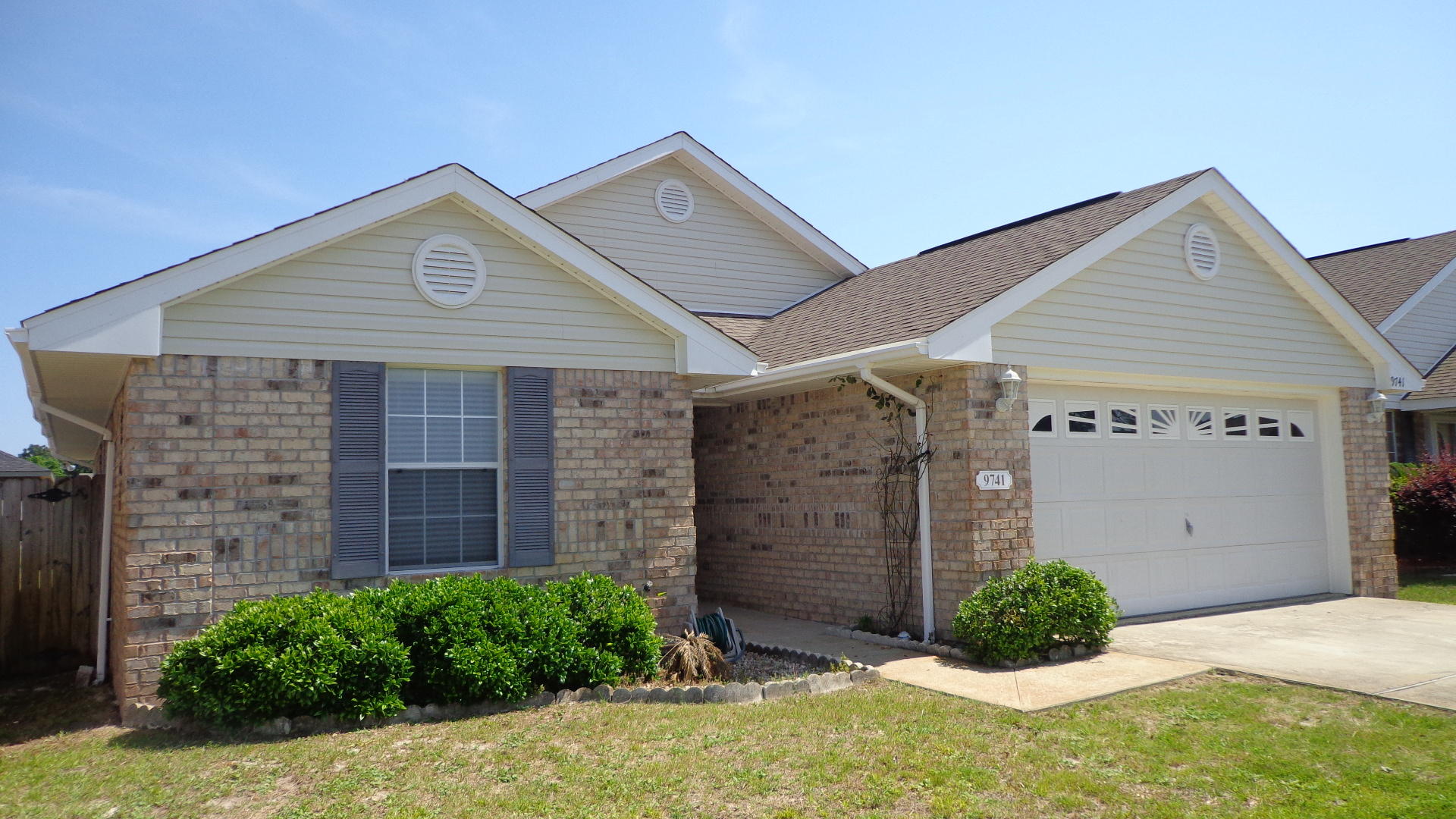 Wonderful all brick home located in a gated community! Enter this 4 bedroom, 2 bath home with vaulted ceilings, separate but open dining room with half wall, large kitchen with breakfast bar and plenty of cabinets for storage (New dishwasher 2013, New Fridge INCLUDED and New Water Heater 2012), pantry and lots of light. Security system installed (will need activation with local service provider), satellite dish included, and wired for surround sound. New outside AC unit 2013. Separate indoor laundry room between kitchen and 2-car garage. Pull-down stairs to attic with light, automatic garage opener, and exterior garage security lights. Sprinkler system and inground well make yard maintenance a breeze. Large privacy fenced backyard has large open patio that would be perfect for