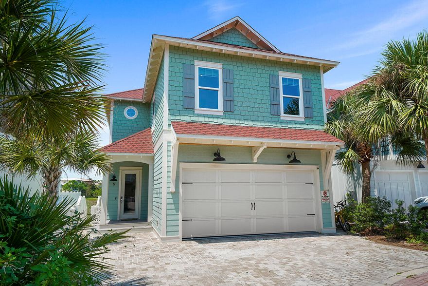 Located in the gated community of Shipwatch in Miramar Beach, this beautiful six-bedroom home easily sleeps up to twenty guests, and is just steps away from Shipwatch's deeded beach access.  Enjoy phenomenal views of one of South Walton's rare coastal dune lakes from your private pool, and pool deck which includes an al-fresco dining area with a picnic table, grill, and plenty of outdoor seating on the large outdoor sectional.  The first floor of the home you'll be greeted by a spacious open floor plan that features a living area, kitchen, and dining room.  The large gourmet kitchen is located right off of the living area, includes marble countertops, a stylish tile backsplash, stainless steel appliances, and a breakfast bar seating four.