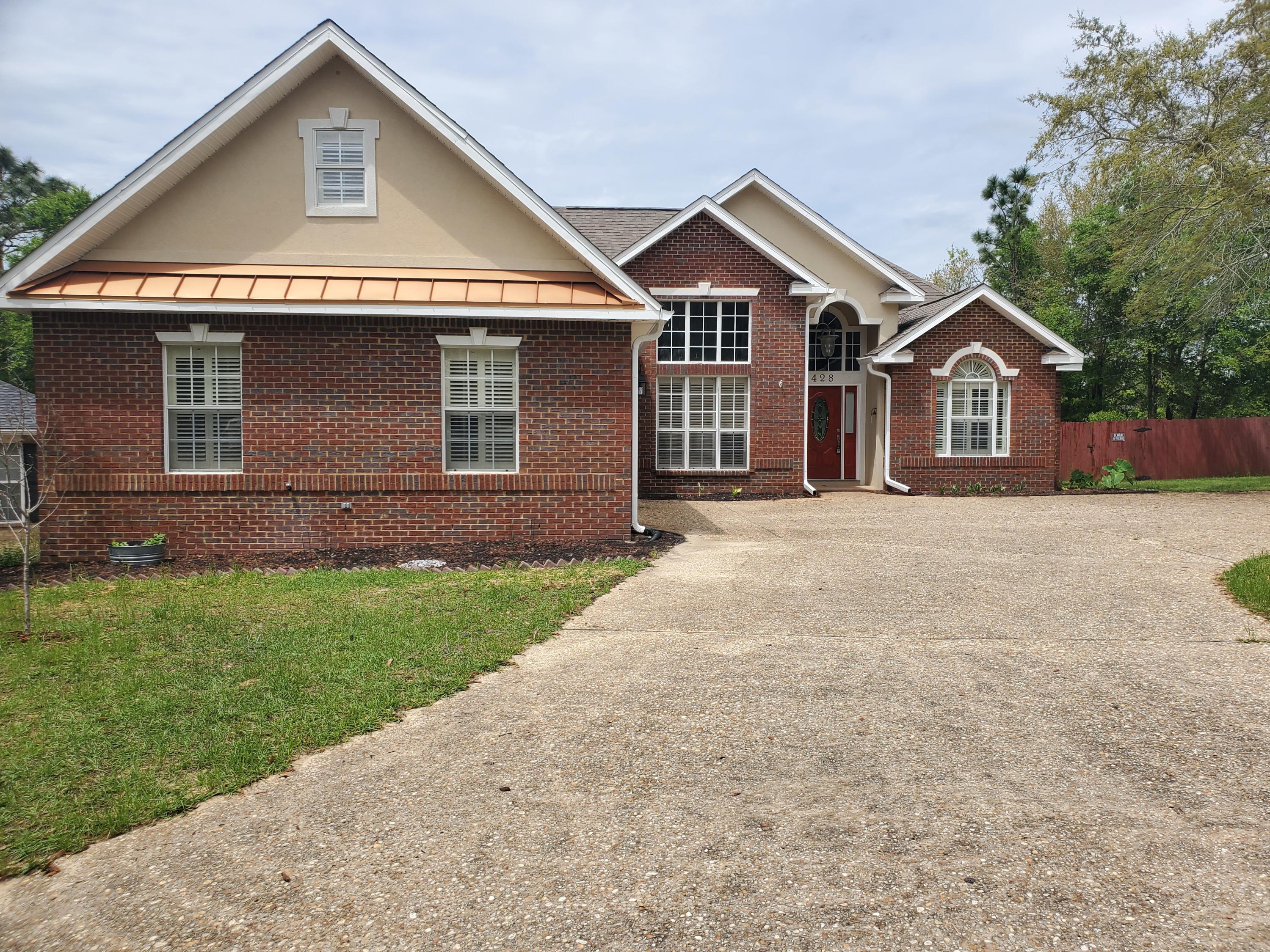 AVAILABLE NOW! Stunning 3 bedroom 3 bath nestled in the heart of Crestview. This all brick beauty is a former American Dream Showcase Home and features soaring 16 ft ceilings, crown molding, formal dining room and large Florida room. Kitchen sports tons of cabinet space, breakfast bar and eat in area. Master bedroom features separate sitting area and barn doors leading to a gorgeous master bath with separate double vanities, stand up shower and a soaker claw foot tub. Split floor plan provides two other bedrooms and a full bath. Huge backyard with a deck for grilling and entertaining. Circle drive and a two car garage provide amble parking. Gas fireplace is inoperable. Tenant responsible for all utilities along with lawncare, irrigation, landscaping and pest control. Pets will
