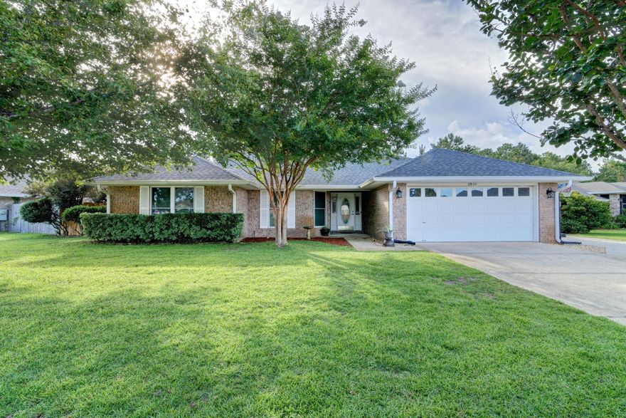 Welcome home to this lovely all brick home in the popular neighborhood of Creetwoods in east Navarre located on a large oversized lot! *Have peace of mind with a new roof installed in 2019, new HVAC in 2019, and new water heater in 2018!* Featuring 3 bedrooms, 2 baths plus a flex room space you'll love this location just minutes from Hurlburt Field. Pull up in the driveway and appreciate the well cared for lawn and tasteful landscaping and you'll love the additional extended driveway space leading to the double gates, and in fact you'll find double gates on both sides of the house! Inside you'll absolutely love the Brazilian Oak hardwood floors that extend throughout and the nice entryway leading to the extremely spacious living room! Complete with vaulted ceilings and a corner wood burning fireplace the living room leads to the kitchen where you'll find a fantastic open layout with a large eat in kitchen space with a center island (tons of cabinetry!). The very large interior laundry room has storage and leads to the two car garage. The master bedroom is a fantastic size with a nice big walk in closet, and the master bathroom is stunning with double vanities, a Jacuzzi tub, and separate tiled stand up shower. The other two bedrooms are nice sized and share a full bathroom. The backyard is one of the largest in the neighborhood with plenty of room for a pool! Fully fenced in complete with a backyard storage building this has all the space that you've been looking for and the privacy you'll love with no neighbors behind you! Enjoy being just minutes from the world's most beautiful beaches, schools, shopping, and Hurlburt Field AFB. Don't miss this gem!