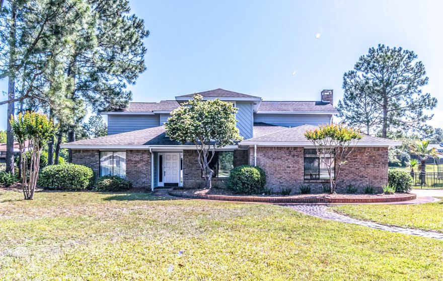 This beautiful pool home in Bluewater Bay is just what you've been waiting for! On the golf course and overlooking the lake, you'll enjoy entertaining inside and outside! This custom-built home features two living areas, 4 bedrooms and 2.5 baths. A cozy fireplace in sight of the kitchen, keeps everyone connected and complements the functional floor-plan. Granite counter tops, stainless appliances and tiled back splash finish out the pass-through kitchen area. Additionally, the downstairs has a formal dining room and the 4th bedroom that can easily function as an office or flex space.