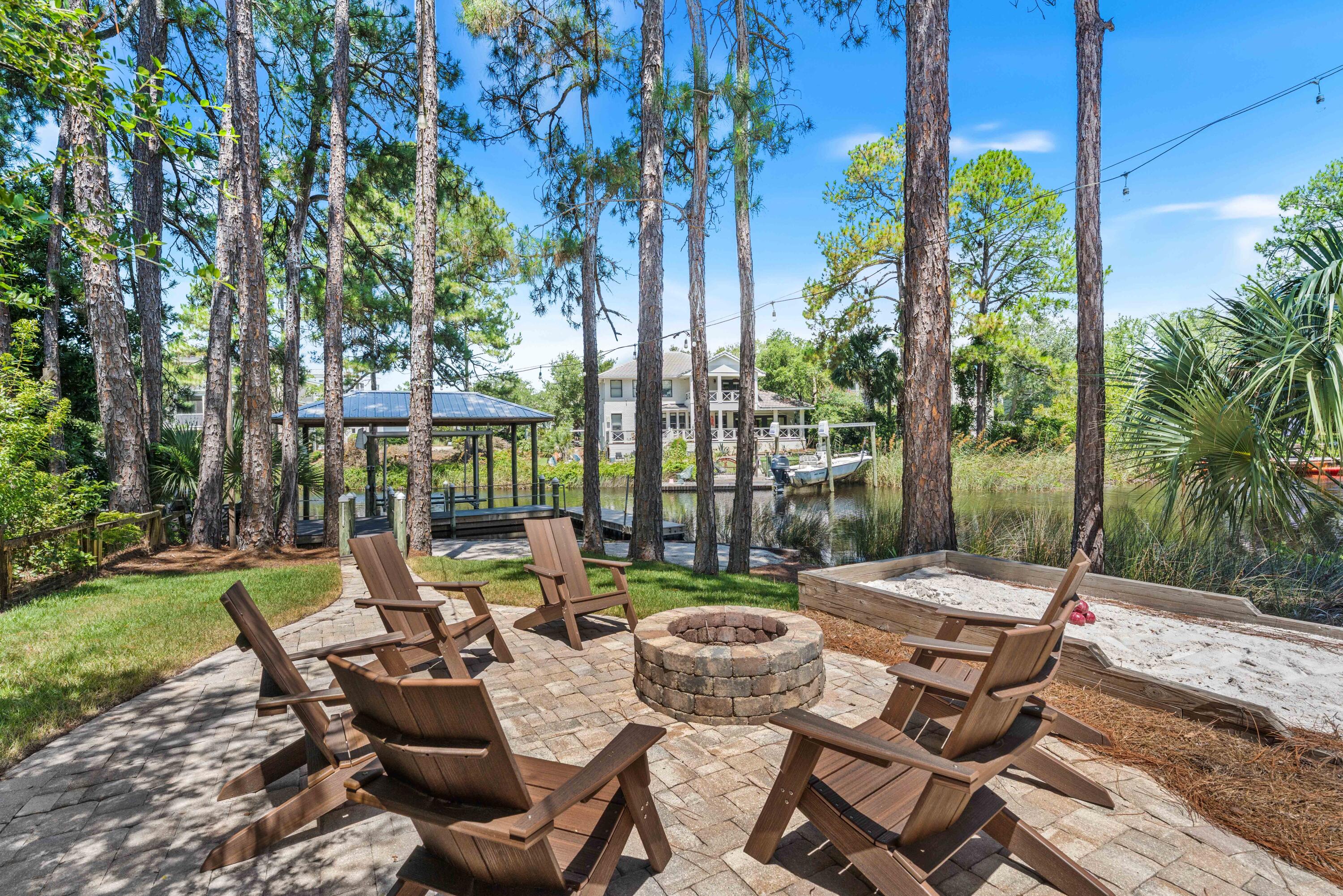 Waterfront Masterpiece! Perched on the peaceful waters of Eastern Lake with panoramic views extending to the Gulf waters, 105 Trae Lane is a true sanctuary with four bedrooms, four bathrooms, and 3,525 square feet of meticulously curated interiors. Spanning four levels featuring elevated craftsmanship, this exceptional residence was completely reimagined in 2022 and offers a rare combination of privacy, waterfront views, and modern sophistication.Inside, no detail has been overlooked. A chef's kitchen is outfitted with top-of-the-line Sub-Zero and Wolf appliances, dual dishwashers, and two ice makers--one is commercial-grade making entertaining effortless. Custom cabinetry with integrated lighting enhances every corner of the home, while other premium features add the touches of coastal creativity. The home's layout includes multiple living spaces and an expansive screened porch, all thoughtfully oriented to maximize views and natural light. Motorized power blinds for the windows on the main level, 100% LED lighting, and two new A/C and furnace units ensure year-round comfort, while a standby natural gas generator, tankless water heater, and state-of-the-art camera and alarm system provide peace of mind.
With two washers and dryers, two climate-controlled garages with additional storage, and thoughtful touches throughout, the home is perfectly equipped for effortless everyday living or multigenerational escapes. This meticulously maintained residence has had only two owners, has never been rented, and remains in pristine condition.
Outdoors, the lifestyle continues with a private boat dock, featuring a covered 5,000-lb boat lift and floating dock ideal for launching kayaks and paddleboards directly into Eastern Lake. From there, cruise straight to the Gulf or explore the serene natural surroundings this unique lakefront location affords.