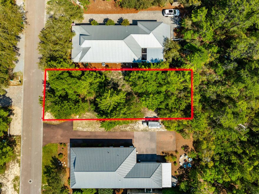 Tucked away on the peaceful and less-traveled west end of 30A, this prime homesite on Spotted Dolphin Road offers the perfect opportunity to craft your coastal getaway or full-time residence. Surrounded by the natural beauty of mature pines and native vegetation, this serene location feels worlds away from the crowds--yet it's just minutes from the sugar-white sands and turquoise waters that make 30A famous.Whether you're looking to build a vacation retreat or an investment property, this lot offers the best of both worlds: quiet privacy with easy access to nearby beach access points, bike paths, and the charming shops and restaurants of Gulf Place.With no HOA restrictions and no build-out time, this lot presents an exceptional investment opportunity. Demand for short-term rentals remains strong in this area, and well-designed homes here can command impressive rental income. The west end of 30A continues to grow in popularity for buyers seeking more space, less traffic, and a true coastal lifestylemaking this an ideal time to invest in one of the area's most desirable locales.