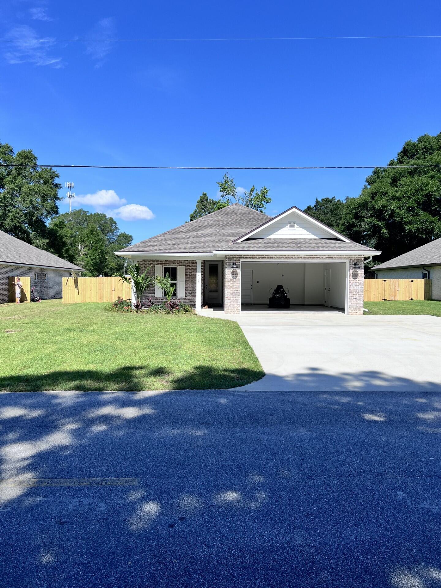 This Beautiful 4 bedroom, 3 bath home is located at the East end of Niceville. The seller pays 10,000 towards the buyer's closing cost, This all brick home sits on .29 of an acre with no HOA fees. You'll absolutely LOVE this OPEN floor plan, featuring 9 ft. ceilings throughout and 10ft where trey ceilings are located. This home boast many custom amenities. Upgraded spray foam insulation in the roof for energy efficiency, 8ft garage door, and extra parking pad for a boat. The kitchen is divine, featuring white custom cabinets, soft close drawers, farm sink, gas stove, pantry, undermount lighting under cabinets and quartz countertops throughout. The island bar has an 18 inch over hang, a reverse trey ceiling in the family room with changeable lighting for seasonal events. Floor plug in the family room. Love entertaining? The kitchen and family room open up to a screened porch with an extra concrete pad for grilling and an extra patio set. The master bedroom has a trey ceiling with recess lighting with and your own private entrance to the screen porch. The custom master bath is wonderful for relaxing, taking a long bath, enjoying endless hot water with the gas tankless hot water heater and the deep soaker tub. The master shower, boast custom tile with a rainhead, 2 separate sprayers, bench for sitting while shaving and seamless glass. You will actually want to do the laundry, with a custom folding table with quartz countertop and custom designer hooks attached above. When you want to relax and rewind, the back yard is the place. You'll enjoy a fully sodded yard, full gutters, sprinkler system, and a privacy fence, making up-keep easy. This home has everything and sits on a large lot. Perfect for a pool, and pets.
The island bar will be SAGE colored and the fixtures will be gold.
Location is perfect, walking distance to Bluewater Bay gym, restaurants, just minutes from A+ schools, Eglin Air Force Base, Special Forces, Emerald Coast beaches, shopping, hospitals and more.
