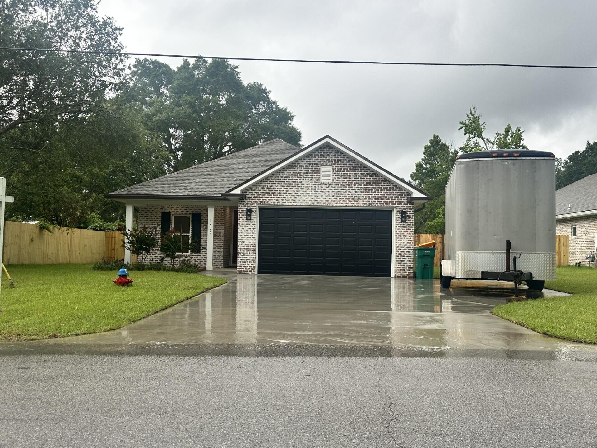 This Beautiful 4 bedroom, 3 bath home is located at the East end of Niceville. The seller pays 10,000 towards the buyer's closing cost, This all brick home sits on .29 of an acre with no HOA fees. You'll absolutely LOVE this OPEN floor plan, featuring 9 ft. ceilings throughout and 10ft where trey ceilings are located. This home boast many custom amenities. Upgraded spray foam insulation in the roof for energy efficiency, 8ft garage door, and extra parking pad for a boat. The kitchen is divine, featuring white custom cabinets, soft close drawers, farm sink, gas stove, pantry, undermount lighting under cabinets and quartz countertops throughout. The island bar has an 18 inch over hang, a reverse trey ceiling in the family room with changeable lighting for seasonal events. Floor plug in the family room. Love entertaining? The kitchen and family room open up to a screened porch with an extra concrete pad for grilling and an extra patio set. The master bedroom has a trey ceiling with recess lighting with and your own private entrance to the screen porch. The custom master bath is wonderful for relaxing, taking a long bath, enjoying endless hot water with the gas tankless hot water heater and the deep soaker tub. The master shower, boast custom tile with a rainhead, 2 separate sprayers, bench for sitting while shaving and seamless glass. You will actually want to do the laundry, with a custom folding table with quartz countertop and custom designer hooks attached above. When you want to relax and rewind, the back yard is the place. You'll enjoy a fully sodded yard, full gutters, sprinkler system, and a privacy fence, making up-keep easy. This home has everything and sits on a large lot. Perfect for a pool, and pets.
The island bar will be SAGE colored and the fixtures will be gold.
Location is perfect, walking distance to Bluewater Bay gym, restaurants, just minutes from A+ schools, Eglin Air Force Base, Special Forces, Emerald Coast beaches, shopping, hospitals and more.