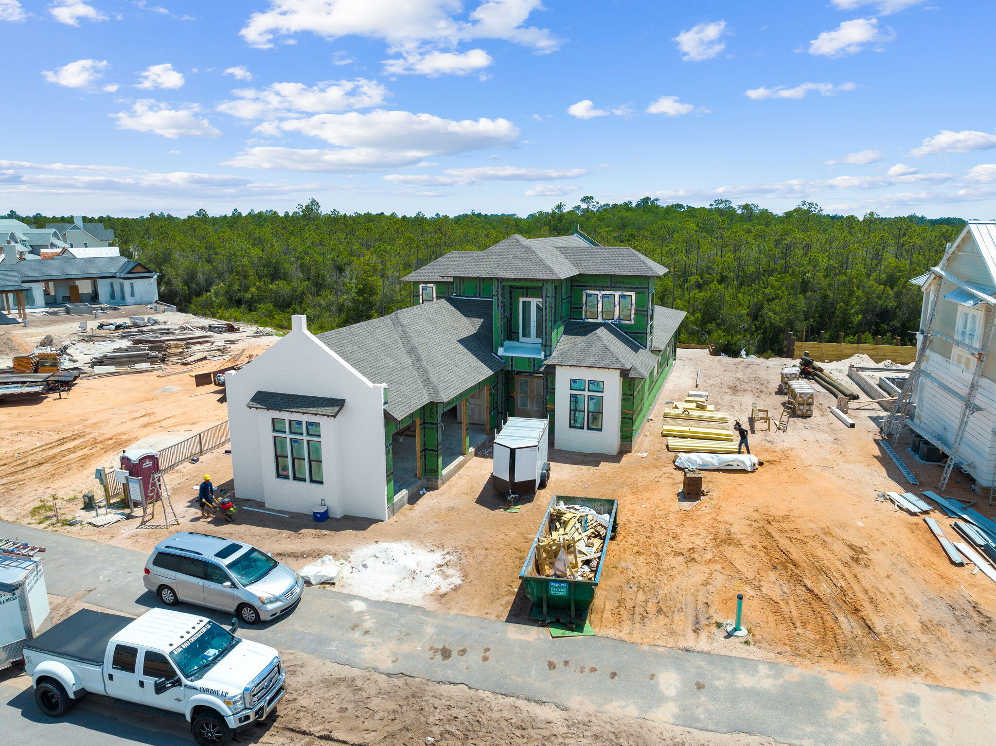 Designed by renowned architect John Williams, this elegant new construction nestled behind the private gates of Camp Creek features impressive craftsmanship with a tasteful coastal flair throughout. A chef's dream, the kitchen encompasses custom milled cabinetry, an oversized island, quartz countertops, and a luxury appliance package with gas range. The expansive living and dining areas are perfectly positioned off the kitchen with direct access to the covered porch with outdoor kitchen effectively blurring the lines between indoors and out while creating a true continuation of living and entertaining space.