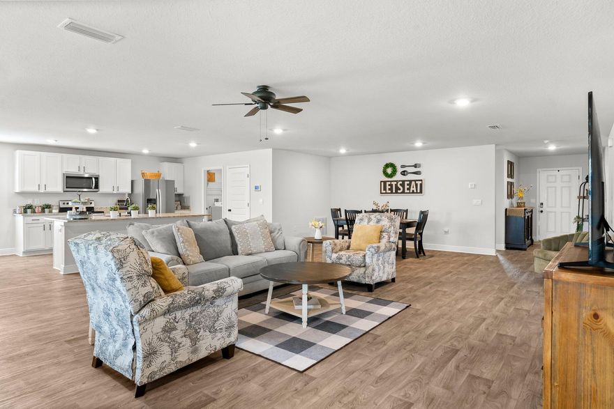 Assumable VA Loan available with a 4.25% interest rate and an approximate balance of $350,000. Better than new and full of charm! This Sawyer plan by DR Horton is tucked inside the welcoming, poolside community of Bridge Harbor. The current owners have added thoughtful upgrades you'll love--stylish lighting, ceiling fans, hardware, a whole-home air purifying system, and a fully fenced backyard ready for kids, pets, or backyard barbecues.Step inside to a spacious open layout with a split bedroom floor plan, giving everyone the privacy they need. The all-vinyl flooring keeps life simple with easy cleaning and a modern, fresh look that can match any style. The kitchen is the heart of the home, featuring stainless steel appliances, granite counters with plenty of prep space, a pantry, an eat-in nook, and even a formal dining area for when you feel like hosting.

The oversized lot gives you room to stretch out and enjoy the outdoors, while Bridge Harbor offers even more with a neighborhood pool, gazebo, and convenient beach access on Carriage Road.

And here's the real bonus: an assumable VA loan with an approximate balance of $350,000 at 4.25%.