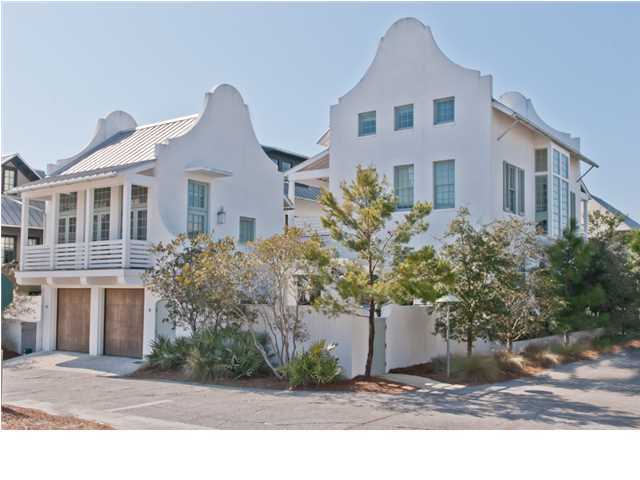 A MASTERPIECE OF DESIGN AND ARCHITECTURE BY PETER BLOCK, this elegant Courtyard style with Main House and Carriage House is fused with marble, white-washed pecky cypress and white oak hardwood floors throughout. A spacious corner lot allows entry from the Boardwalk into the Pool/Spa courtyard or through a massive front door from Town Hall Road. In the Main House, Level 1 host an open Living/Dining/Kitchen with an alcove 2nd living room with fireplace. A guest or pool bath may be accessed from yet another entry. Level 2 enjoys the large Master Suite with Bath, walk-in closet, laundry, and sitting room/office. A separate office provides an additional work space. Level 3 features a lounge, laundry, and 2 Guest Bedrooms with ensuite baths. In the Carriage House, Level 1 above the garage has an