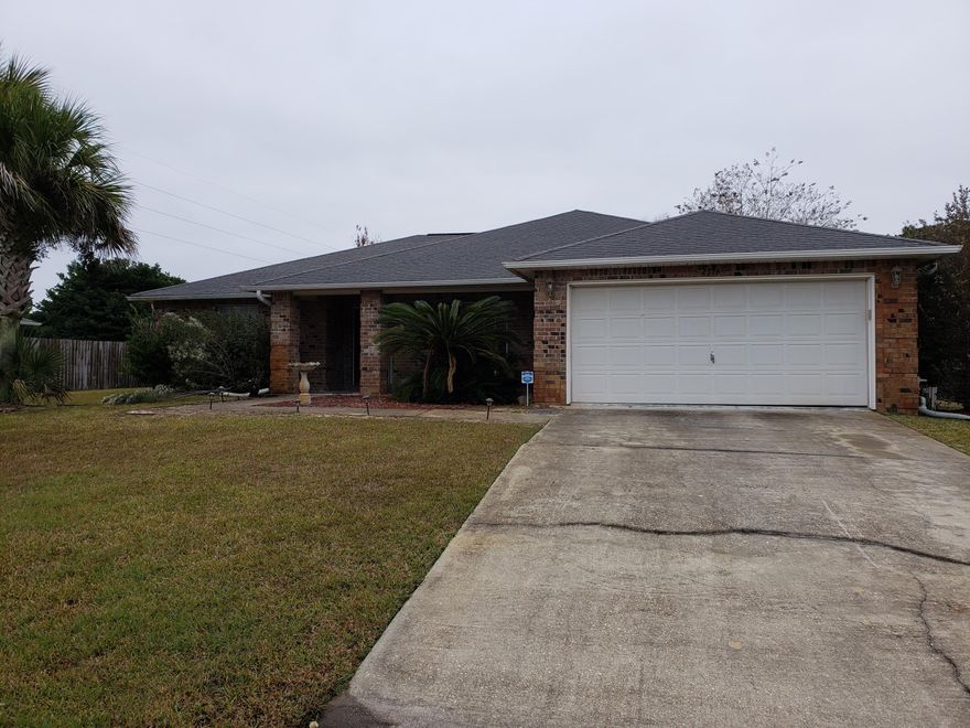 Centrally located between Pensacola and Destin, Sits Navarre . All brick home on a half acre lot. split bedroom plan with a large kitchen. Also has two living areas for the growing family. New flooring in home. easy to show .