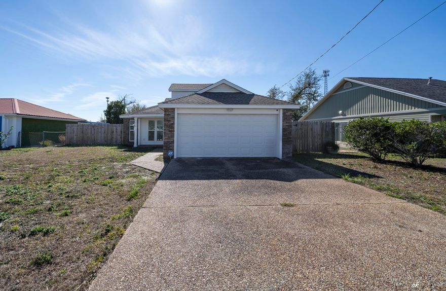 This fully renovated two-story home is completely move-in ready. Updates include luxury wood-look tile flooring, oak wood stairs, and a brand-new kitchen with custom cabinetry, quartz countertops, and stainless steel appliances. Major improvements include a new roof (2022), new HVAC system (2023) with a 10-year warranty, new water heater, and updated plumbing, electrical, ductwork, insulation, and drywall. Exterior upgrades completed in 2023 include cement board siding, new windows, doors, trim, and fresh interior and exterior paint. The main-level primary suite offers private backyard access and an en suite with dual sinks and a tiled walk-in shower. A guest bedroom and full bath are also downstairs, with a third bedroom upstairs for added privacy. Additional features include an oversized two-car garage, extended driveway, and a fully fenced backyard with a large side gate ideal for RV, boat, or trailer parking. Located in Flood Zone X with no flood insurance required and just minutes from the new 7 Brew in the growing Callaway area.