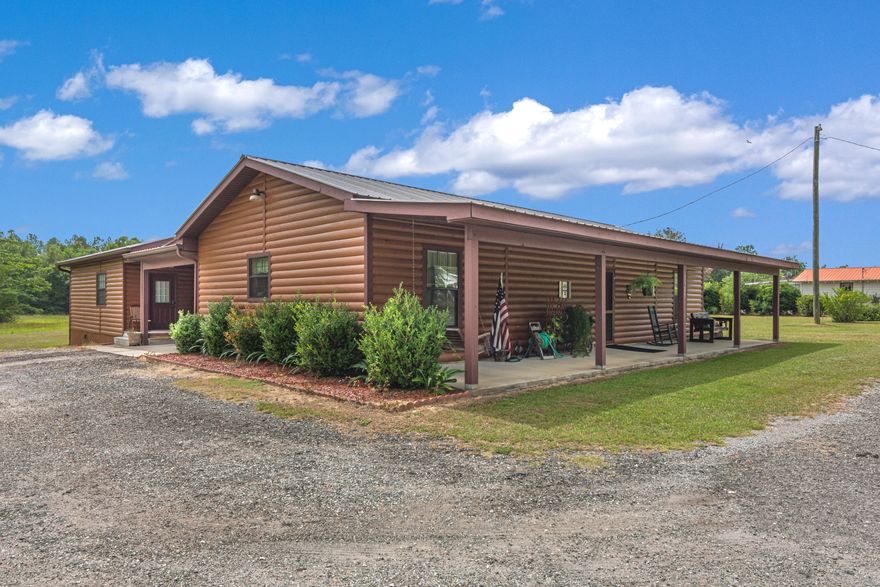 Just over 16 beautiful acres in Baker! This log cabin home is so unique and has tons of character. Main part of home has large, open kitchen/living space, oversized master with huge walk in closet and large bathroom. Beautiful wood detail on main area ceilings. Granite countertops, gas stove! Large covered front porch! Tankless gas hot water heater and plumbed for gas grill and gas dryer. Baker water. The other bedroom/bath is connected by the carport and its own entry and exit with handicap assesible ramp.