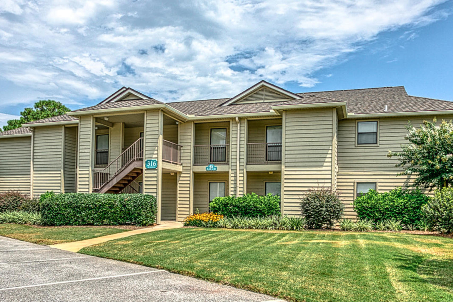 PRICE REDUCED AGAIN & AGAIN! Here's the lowest priced 3BR in Seascape Golf and Beach Resort! Ideally situated on the 16th hole, Unit 45B is fully furnished with everything you need for a 2nd home, vacation rental, or full-time living. Convenient ground floor location, spacious open floorplan with combined Kitchen/Living/Dining, pantry, washer/dryer in unit, new roof in 2019, and an exterior owner's closet to store all your beach toys. Generous Master features en suite Bath with separate shower/tub, and living area has ample natural light. Relaxing covered patio can be accessed from living room, master, and guest bedroom. Cable TV, internet, water/sewer, exterior insurance, quarterly pest control, amenities, and grounds keeping are all included in your dues. Call today for more details!