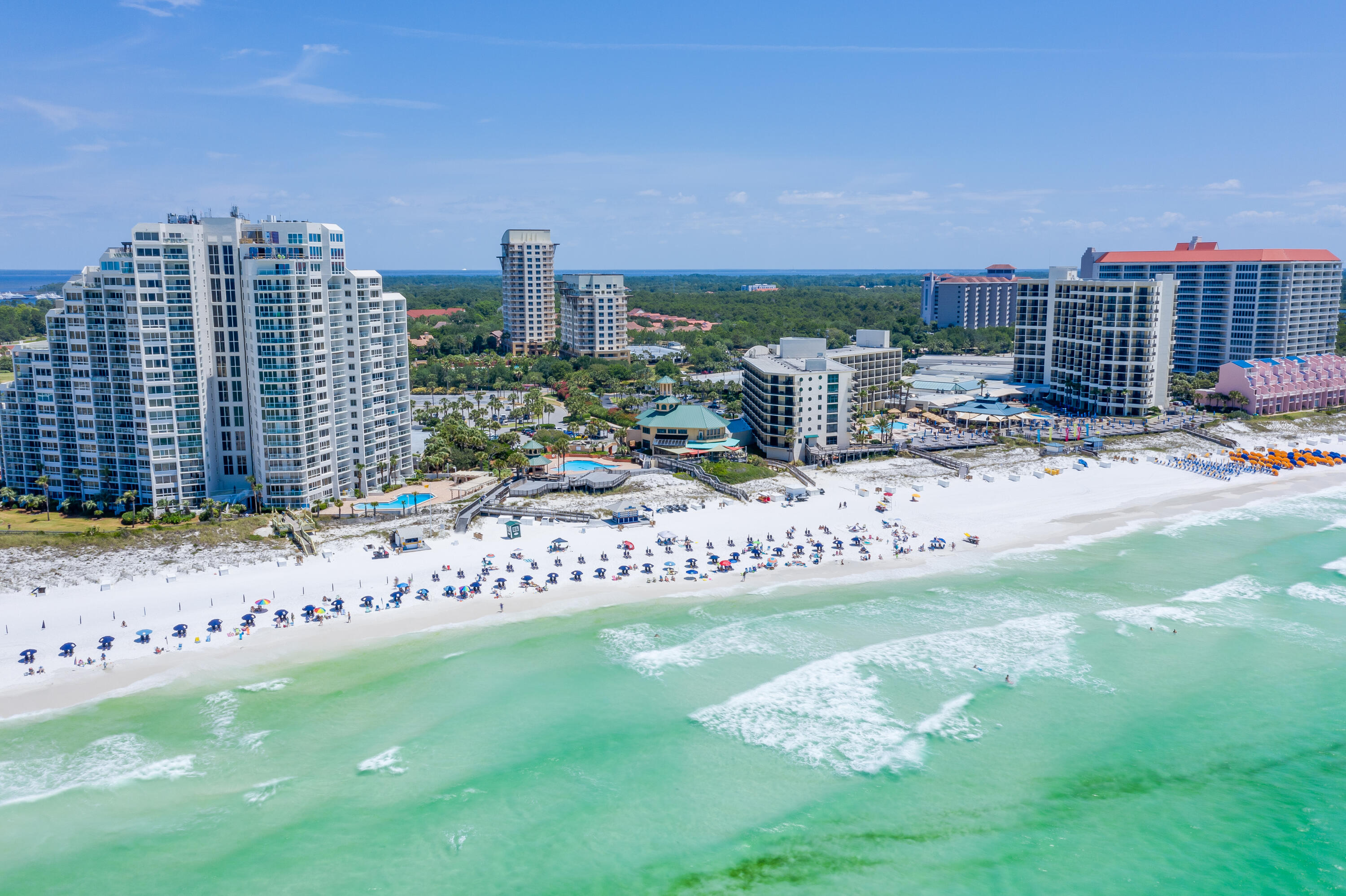 Enjoy panoramic views of the Gulf of Mexico, Choctawhatchee Bay, lake, and golf course from the balcony of this updated 8th floor studio. Luau is a private, intimate resort within the resort gates of Sandestin, offering a heated salt water pool with water falls, fitness center, covered parking, a top floor observation deck with stunning views of the entire coastline and is adjacent to Sandestin Resort's famous beaches. Conveniently located across the street from the resort private beach access, this west facing studio is beautifully appointed and newly updated with coastal decor and plank style tile flooring. Complete with a king size bed, sleeper sofa and dining area, you can comfortably accommodate 4 guests. This unit also offers a generous size full bath, kitchenette with a refrigerator, microwave and small kitchen appliances and utensils. Do not miss out on this perfect investment opportunity or personal vacation home in paradise!