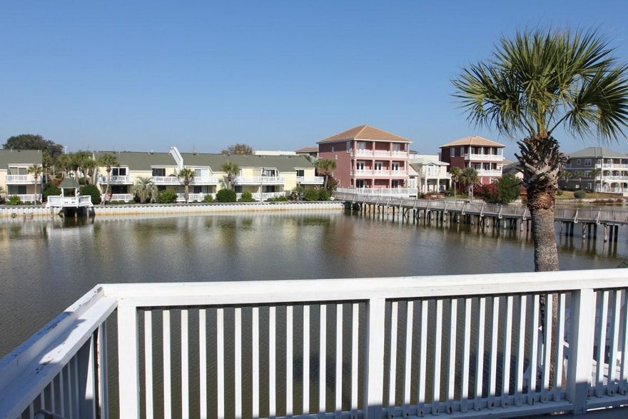 Beautiful Lakefront End Unit with Views from 2 Balconies (Master Bedroom and Living Room). This beachside unit at Southbay by the Gulf is also steps from the beach and boasts great rental potential! The property has 2 pools, one on each side of the lake, and 2 tennis courts. The unit has been renovated and is currently on the on-site rental program.