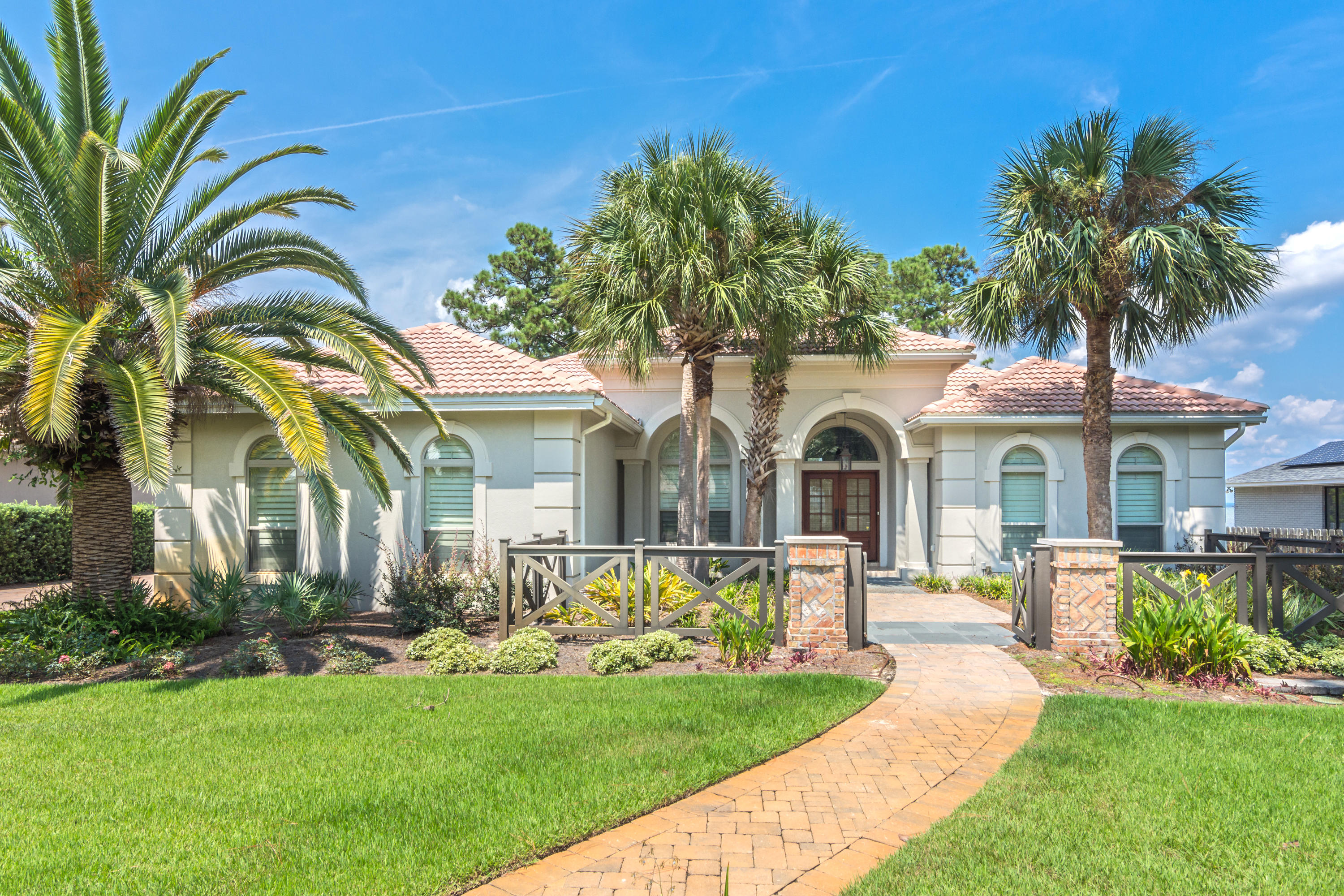 This beautiful 3 bedroom home with 100 ft of bay-front shoreline is a must see! An enclosed spectacular nearly new pool & spa, an extensive dock with lounge space, and a covered boat lift make spending time outdoors a breeze and offer plenty of space to enjoy the serenity of living on the bay. Inside, you are met with an abundance of natural light and stunning bay views through the multitude of windows in the home. A sprawling open floor plan makes the home feel much larger than the square footage implies. Updated throughout and features 10-12ft ceilings, crown molding, a fireplace, built-ins, accent lighting, and more. A two-car garage w/ large H/C storage room, lush landscaping are just a few of the many other features to appreciate. For a 360 Tour, check out http://bit.ly/308ShoreD