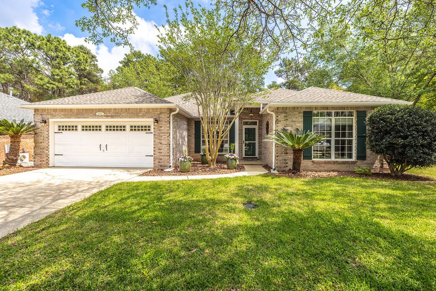 Charming 4 Bedroom, 2 Full Bath Home located in the desirable gated community of Parkwood Estates. When you walk inside you will notice the Dining Room to the left with white wainscoting and a Spacious Kitchen. The Family room has a gas fireplace and a cathedral ceiling. The Kitchen features a big breakfast bar that will fit 6 stools, built in sink, custom maple cabinets, stainless appliances including a gas stove, granite counter tops and a pantry. The laundry room has custom shelving and racks for lots of storage. This home has the desirable open floor plan with recessed lighting throughout and crown molding in the entry way and dining room.  The master bedroom is tucked away off the kitchen and the updated Master Bathroom has his and her vanities with waterfall faucets, a large soaking tub and a separate tiled shower. The master closet is deep and spacious. The other 3 bedrooms are located on the other side of the home with newer carpets and a shared updated main bathroom. One of the bedrooms has a unique secret bookshelf door for added fun. There is a screened porch for entertaining and out back you have a fully fenced backyard, a fire pit, shed, gas stub for your grill and even private access to Eglin Range. In the garage you will find a mud sink and plenty of storage to include attic space with brand new stairs. This home has brand new fixtures, new garage door and motor, new electrical panel, and a new hot water heater.  Roof is 2017 and HVAC is 2018. Bathrooms were updated in 2021 and exterior of home was just power cleaned, new bedroom ceiling fan and new fan on back porch. Termite bond in place with Bryan's Pest. This home has it all in a great community next to Bluewater Bay Elementary School, restaurants, beaches, Eglin AFB and so much more.