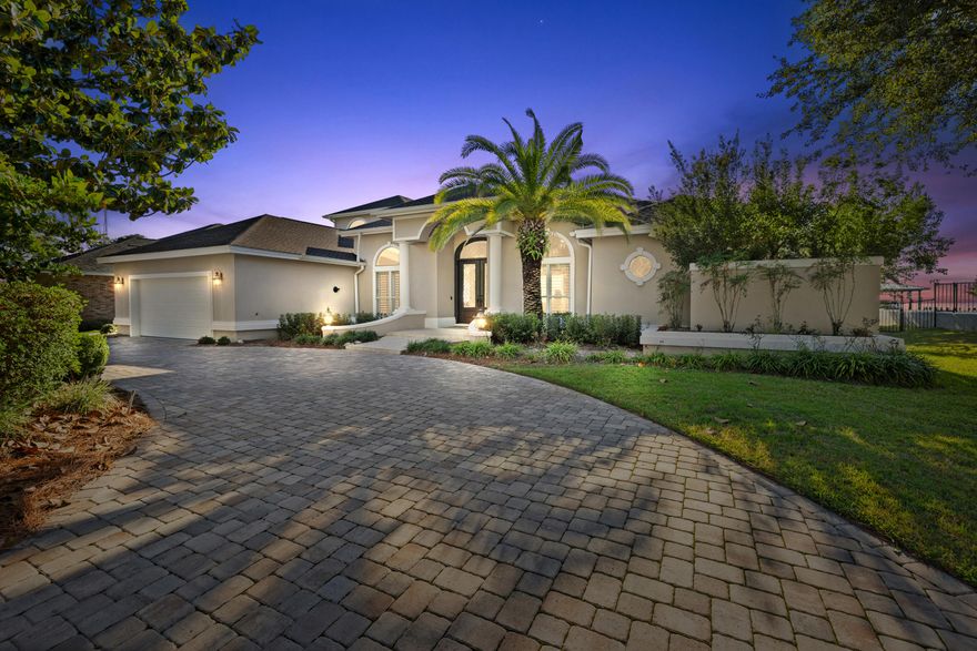 Experience the pinnacle of coastal living in this stunning bayfront home, located within the exclusive gated community of Southwind at Bluewater Bay. Offering unparalleled views of the bay, this beautifully designed residence blends serene elegance with modern amenities, creating a truly exceptional living space. As you enter this remarkable home, you're immediately captivated by panoramic water views that grace nearly every room, ensuring breathtaking sunsets and tranquil vistas throughout the day. Spend your mornings watching dolphins play in the bay from the comfort of your own living room or private dock. The open floor plan seamlessly connects living and dining areas, perfect for entertaining or simply enjoying the peaceful surroundings. The chef's kitchen is a culinary dream, featuring high-end finishes and ample space for preparing gourmet meals. The master suite offers a luxurious retreat with a custom closet for optimal storage and organization. Split bedroom layouts provide privacy, and soaring ceilings from 9 to 12 feet throughout the home enhance the airy, expansive feel. Step outside to your own private oasis complete with a screened-in heated pool and spa, perfect for relaxation and entertaining. The recently installed dock, boathouse, and covered boat lift (2021) provide direct access to the water, along with a brand-new swim platform, allowing for endless aquatic adventures right at your doorstep.

Additional features include a convenient half bath with direct access to the pool area, a 2021 roof, a 2023 tankless water heater, premium attic insulation installed in 2023, and three HVAC units from 2015. As a resident of Bluewater Bay, you'll enjoy access to a wealth of amenities, including tennis courts, a championship golf course, and a marina, making this home a gateway to an extraordinary lifestyle. Don't miss your chance to own this piece of coastal paradise. Schedule a showing today! For more information about the Southwind community, visit www.southwindpoa.org.