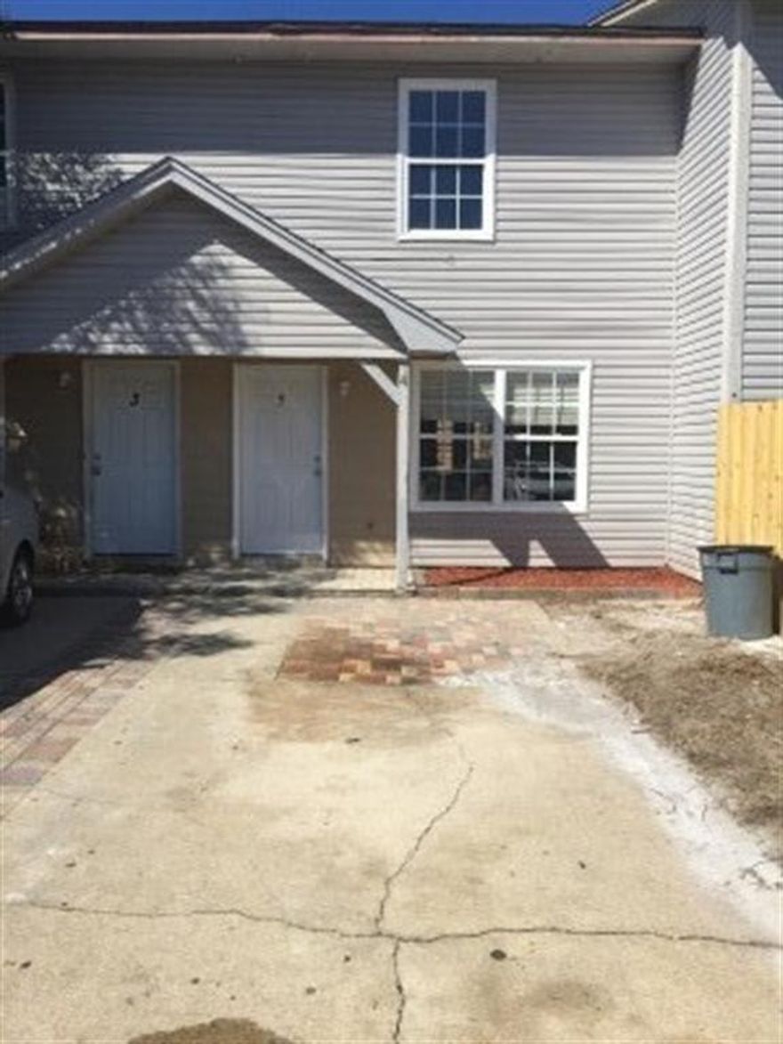 Investors Dream!! No HOA fees. Great Rental in high demand location. Move in READY. Large Townhouse located in the Heart of Destin. Two spacious bedrooms upstairs and full bath. Downstairs offers large open Living/dining area, tile flooring, new kitchen counters/cabinets/sink and oven added in 2013. New Hot Water heater replaced in 2014. Back yard has privacy fence and deck and brick pavers.