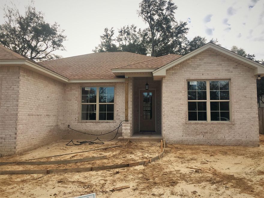 Beautiful, BRAND NEW 4 bedroom home located in the heart of Niceville! EXTERIOR FEATURES: all brick exterior, fenced in back yard, 2 car garage w/ auto opener, irrigation system, full landscaping. INTERIOR FEATURES: foam insulation, 8' doors throughout, espresso cabinets, granite kitchen counter tops, marble bathroom vanity tops, marble tub/showers, recessed lighting, stainless steel kitchen appliances, tile in foyer/kitchen/utility/bathrooms, carpet in guest bedrooms, laminate wood flooring in master & all other areas, large crown molding in main areas, large baseboard throughout. OTHER FEATURES: A 1-yr builder warranty is provided, seller will pay a TOTAL of $4000.00 towards ALL closing cost (buyers & sellers), title & closing to be held with Tammy Jones at First National Land & Title.