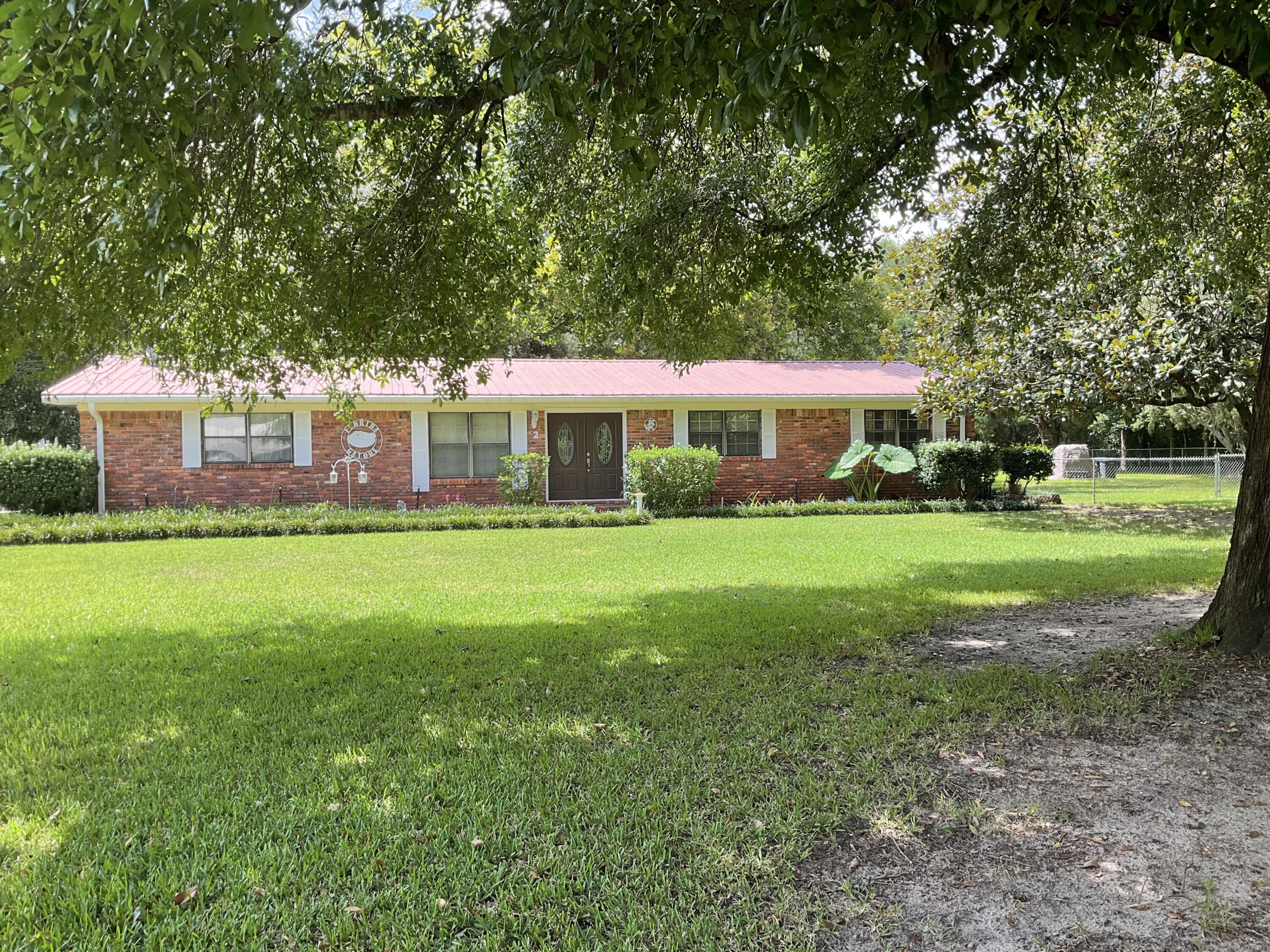 BIG OAK TREES & MAGNOLIA TREES surround this beautiful 1 acre - landscaped, fenced backyard home! Convenient location, this home has plenty of space inside & out for entertaining. Family room has fireplace w/insert, built-in bookshelf's, kitchen has all the appliances, soft close doors/drawers, pantry w/pull out shelfs, breakfast bar+ dining room. Large foyer w/office to the left, good size bedrooms as well. Workshop + storage building has roll up door, garden sink, covered back porch for relaxing in the evenings. Well established neighborhood, pump for sprinkler system. Call to see today!