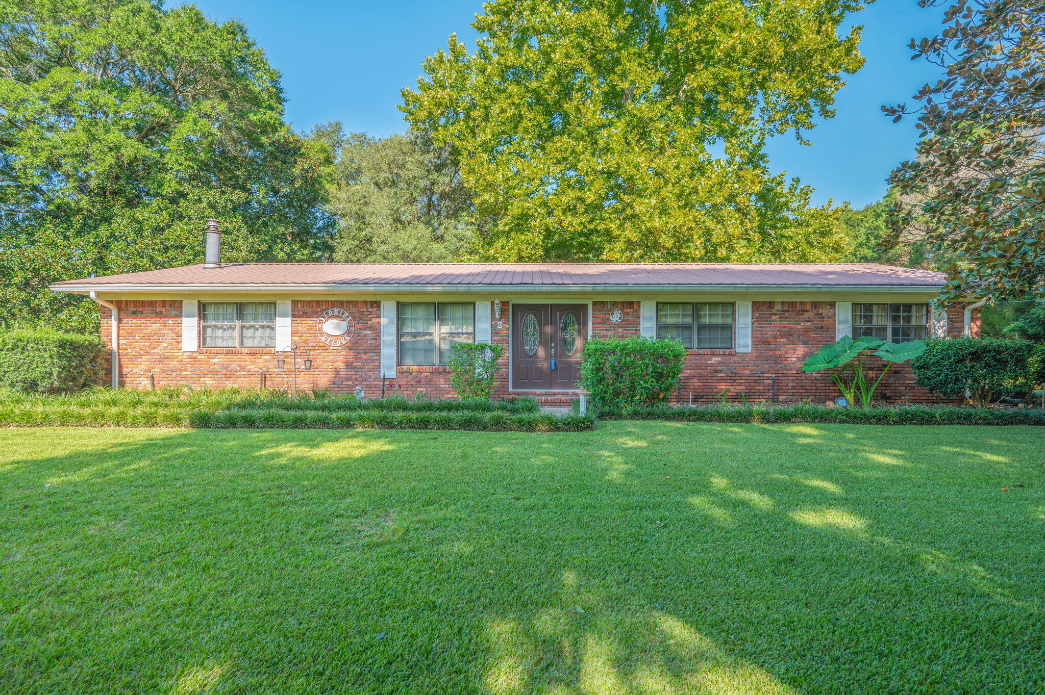 BIG OAK TREES & MAGNOLIA TREES surround this beautiful 1 acre - landscaped, fenced backyard home! Convenient location, this home has plenty of space inside & out for entertaining. Family room has fireplace w/insert, built-in bookshelf's, kitchen has all the appliances, soft close doors/drawers, pantry w/pull out shelfs, breakfast bar+ dining room. Large foyer w/office to the left, good size bedrooms as well. Workshop + storage building has roll up door, garden sink, covered back porch for relaxing in the evenings. Well established neighborhood, pump for sprinkler system. Call to see today!