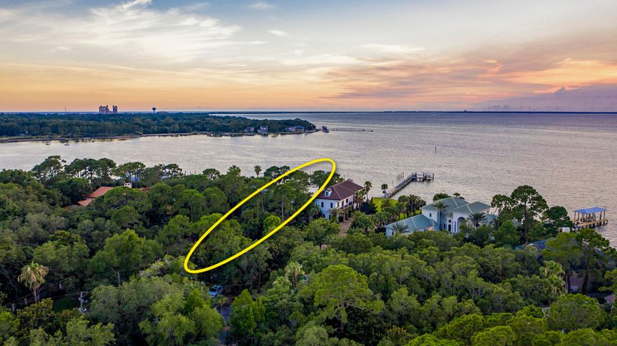 Stunning Estate-Sized Property located on the Private, Exclusive Street known as Bambi Drive of Cobb's Point, oriented on 165' of deep-water water at the point of Joe's Bayou and the scenic Choctawhatchee Bay of Destin, Florida. This Caribbean-inspired home showcases a fabulous and expansive water view corridor from its primary living area, including the kitchen and dining room. The sunsets are breathtaking!  This home features solid wood floors, granite kitchen countertops, wet bar, wine cooler, and an ice maker in the living room.  The master bath contains a Jacuzzi tub, walk-in shower, and Caldera Spa.  The Sonos surround system provides indoor and outdoor listening capability.  The pricing of this opportunity is of profound value for simply the lot if it were vacant, thus a....