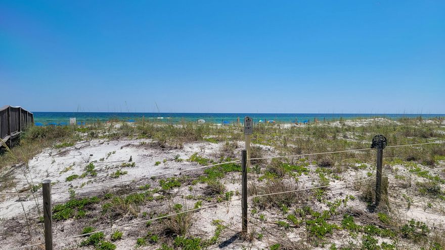 INVEST OR LIVE at this conveniently located FIRST FLOOR unit at the recently remodeled Surf Dweller on Okaloosa Island! HOA DUES REDUCED 1/1/25. Features at this well-maintained large 2 bd/2 ba condo include a huge patio for entertaining, LARGE OPEN KITCHEN with ample cabinet space, granite counters, breakfast bar; private GULF FRONT MASTER SUITE with patio walkout, and a spacious guest bedroom that could sleep 4 comfortably. New LVP flooring in the bedrooms!! Condo has neutral paint colors throughout. Additional features include a nice size pantry & laundry room (W/D included!), and large patio just steps from the beach walkover! Surf Dweller has lush, landscaped grounds, swimming pool with sundeck, kiddie pool, BBQ grills, tennis courts, covered parking, and private walkover to beach.