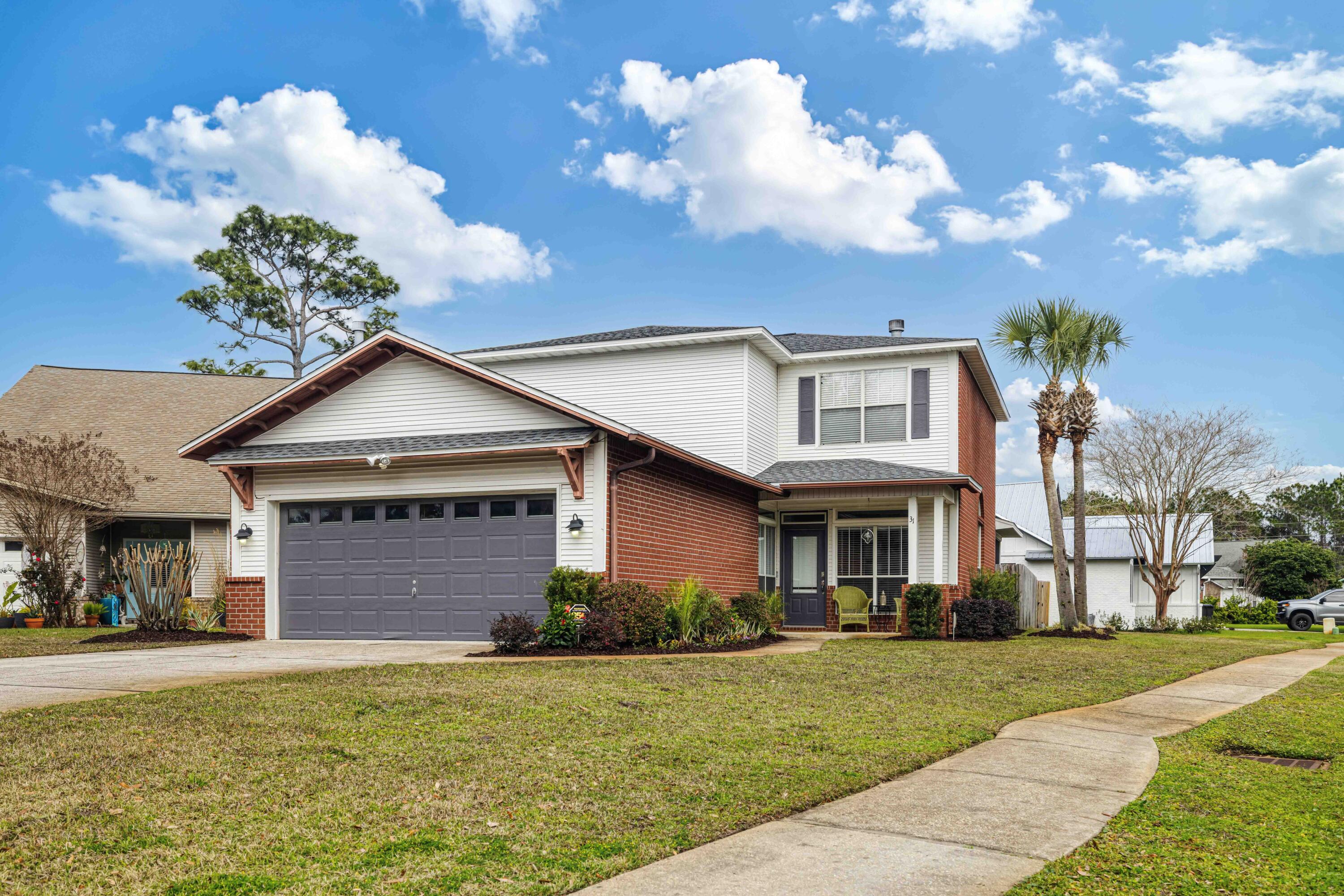 Welcome to 31 Corte Lago, a 4-bedroom, 2.5-bathroom home in the heart of Santa Rosa Beach, Florida. This 2,556-square-foot residence seamlessly blends coastal charm with modern comfort, offering a bright and inviting atmosphere.Meticulously updated with fresh paint and modern wood flooring throughout. The first-floor primary suite feature custom 'California Closets' as well as the upstairs guest bedroom. Positioned South of 98 in Escada on a cul-de-sac with a fully fenced in backyard, this home offers access to fantastic community amenities, including pool, tennis courts, and scenic walking trails. Plus, you're just minutes from the white-sand beaches of 30A, top-rated dining, and boutique shopping. Don't miss this incredible opportunity for turnkey living~updates list in Docs
