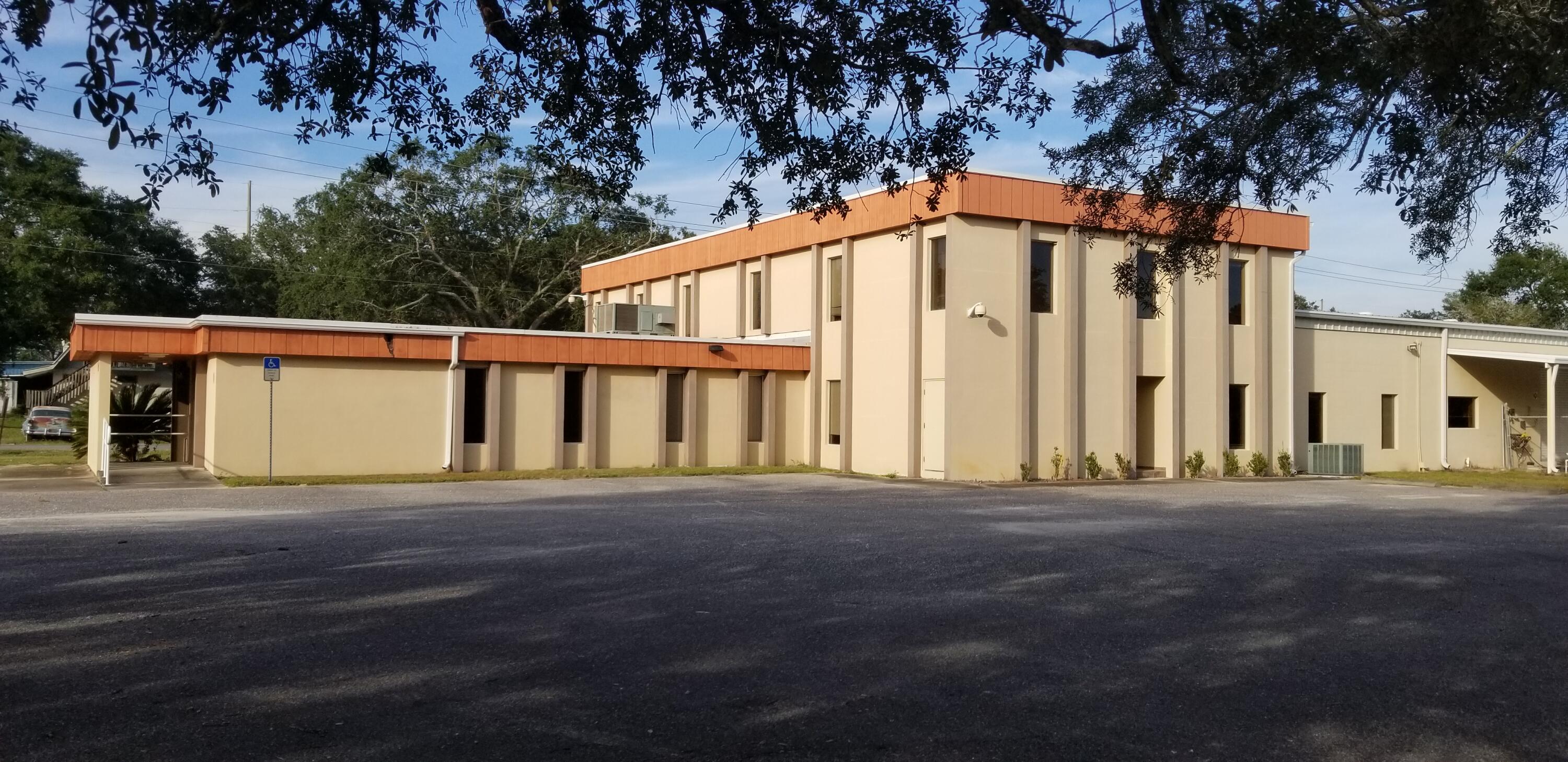10,103 sqft concrete block building with some 2nd floor office, warehouse area with three 12'x10' rollup doors and graveled fenced in lot. Over 20 individual offices, administrative/reception area, kitchen/break room, 5 restrooms, approx. 4.5 acres zoned Mixed Use. Fronts on 3 paved streets, Denton Blvd., Scott Lane, and Tyner St. Furniture and personal property not included.