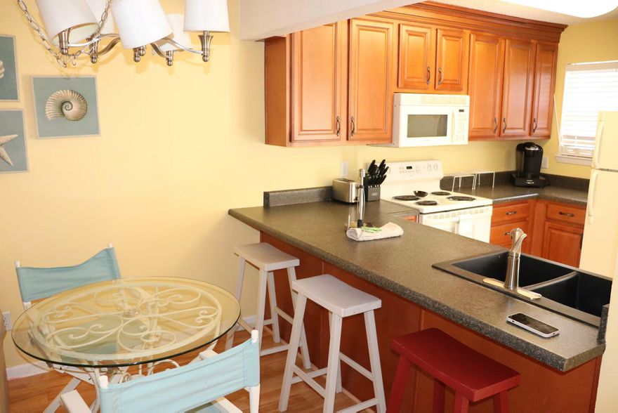 6 Month Lease, $1,500 deposit, Available Now!ALL UTILITIES INCLUDED (WIFI, CABLE, ELECTRIC, WATER, SEWAGE). This FURNISHED 2-bedroom, 1-bathroom property on Okaloosa Island at 375 Bluefish Dr offers 875 square feet of living space. The living room features ample natural light and is designed for comfortable seating arrangements. The kitchen includes a dishwasher for convenient meal preparation and cleanup. Each bedroom provides sufficient space for furniture and storage. The bathroom is equipped with standard fixtures and offers functional space. Additional amenities include air conditioning and a smoke-free environment. The exterior features a well-maintained facade and surrounding area. WASHER AND DRYER IN-UNIT.