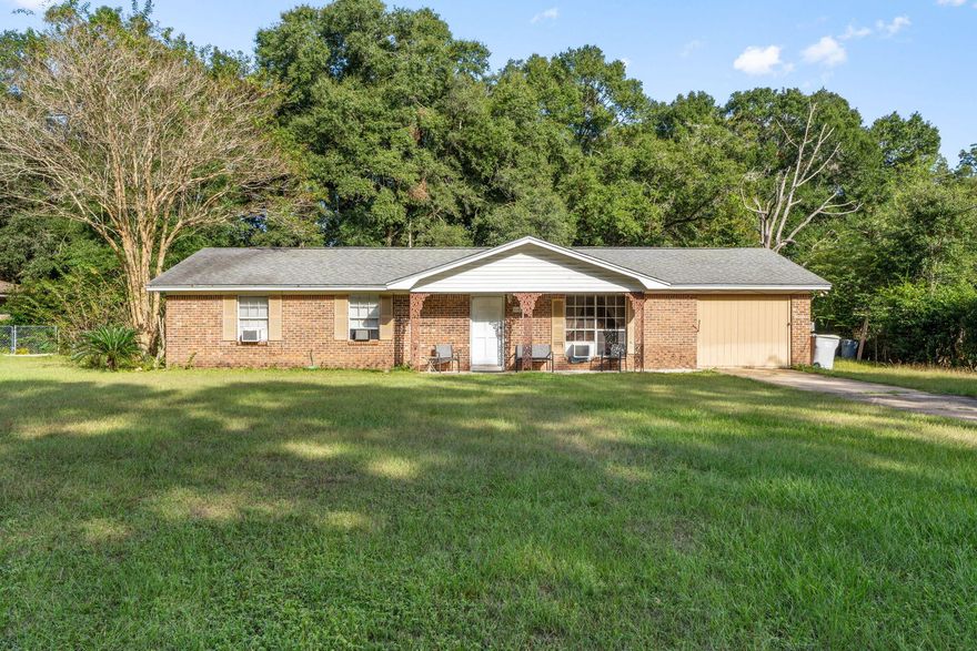 Charming 3 bedroom 2 bath brick ranch home on nearly half an acre with beautiful mature trees and a fenced backyard. Enjoy the freedom of no HOA with RV hookups and plenty of space for parking, boat storage, or outdoor hobbies. This home features a spacious living room, a bright kitchen with breakfast bar and ample cabinets, and a large dining area perfect for gatherings. The garage has been partially converted and includes laundry hookups but still retains the original doors for easy reconversion if desired. Central heat and air are not currently operational but window units provide comfort. With solid structure and great potential, this home is ideal as a starter home, rental investment, or renovation project. Being sold as is and investors are welcome.