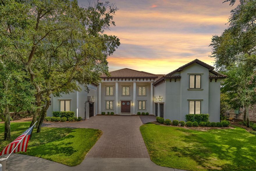 This Modern Italian Villa is located on the secluded street of Olde Plantation Place in Kelly Plantation is perfect for a large family that loves to entertain.  This home boasts 6-bedrooms,  5-full and 2-half baths.  Approaching the home, you will be greeted by numerous Bevolo copper gas lanterns and monumental white columns.  Upon entry, the 20'+ trayed ceilings, floating staircase and breezeway set the ambiance of the home.  The first floor features an open dining area, large family room and  wet bar, along with a television and fireplace finished with white brick Nepal stone.  The large kitchen is a chef's delight featuring an oversize island, dual Subzero refrigerator/freezer, Wolf range, prep sinks and a casual dining area overlooking the pool lanai.