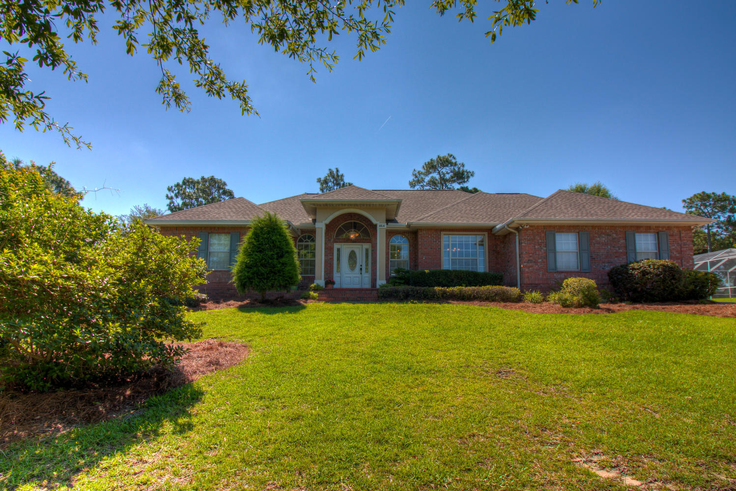 Move in ready, all brick home in desirable Rocky BayouThis well maintained stately brick home has great curb appeal with a paver driveway and a newer 2016 dimensional shingle roof. When you enter the home you be impressed by the high ceiling and professionally painted interior. The home has a beautiful great room with a natural gas fireplace and built in shelves. You will also find crown molding, recessed lighting and updated flooring. The great room overlooks a patio pool which is screened in and a pool deck which has plenty of room for outdoor entertaining. Next to the great room is the kitchen which has gorgeous granite counter tops, gas stove, breakfast nook, breakfast bar and is well positioned by overlooking the pool with quick access to the covered patio.