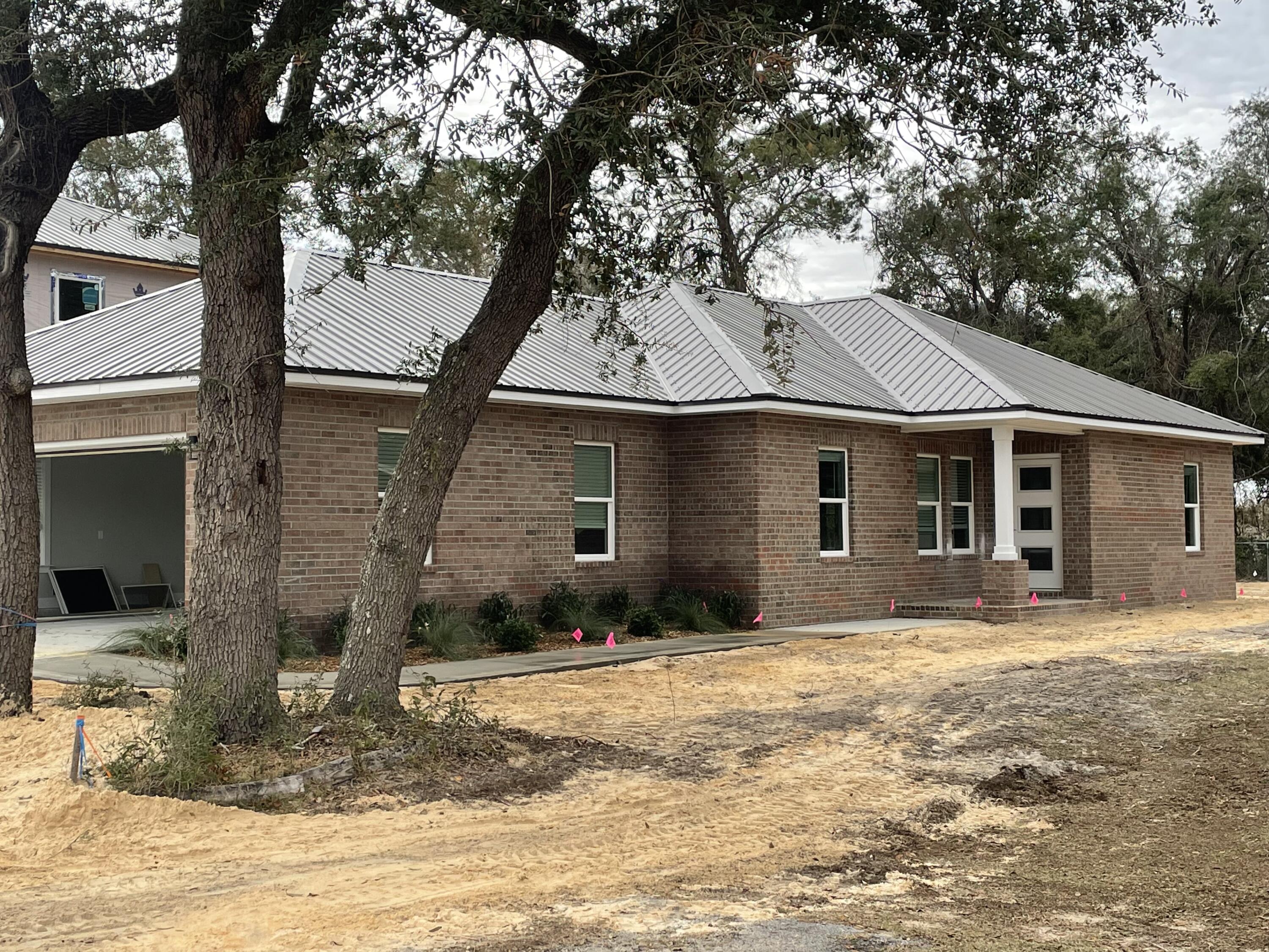 Coming Soon, 3BR/2BA new construction home located in Niceville! The home is on a block of 8 new homes being built within the Villa Tasso subdivision. Home is conveniently located to Destin mid-bay bridge connector, grocery stores, shops, restaurants and much more. Home features include: 2 car garage, split bedroom floor plan, granite countertops, white shaker cabinets, built in custom shelving, walk in pantry, LVP flooring, tile in baths, tile surround in master bath, cased windows, full kitchen appliance package, automatic sprinkler system and fenced lawn area. Call or text to schedule a showing today! Buyer to verify all dimensions, information and pertinent details.Note: Finished exterior image is of a previous build. Attached floor plan image is flipped