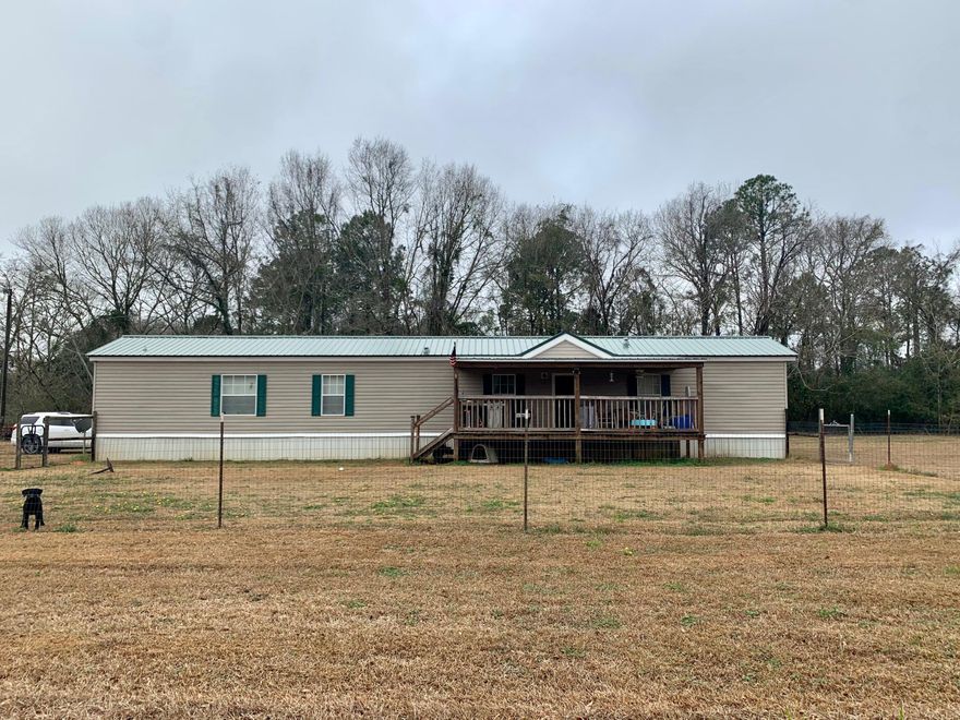 Great home sitting on 2.74 acres. Property has a new metal roof. Large deck built out back. Being entered for comp purposes